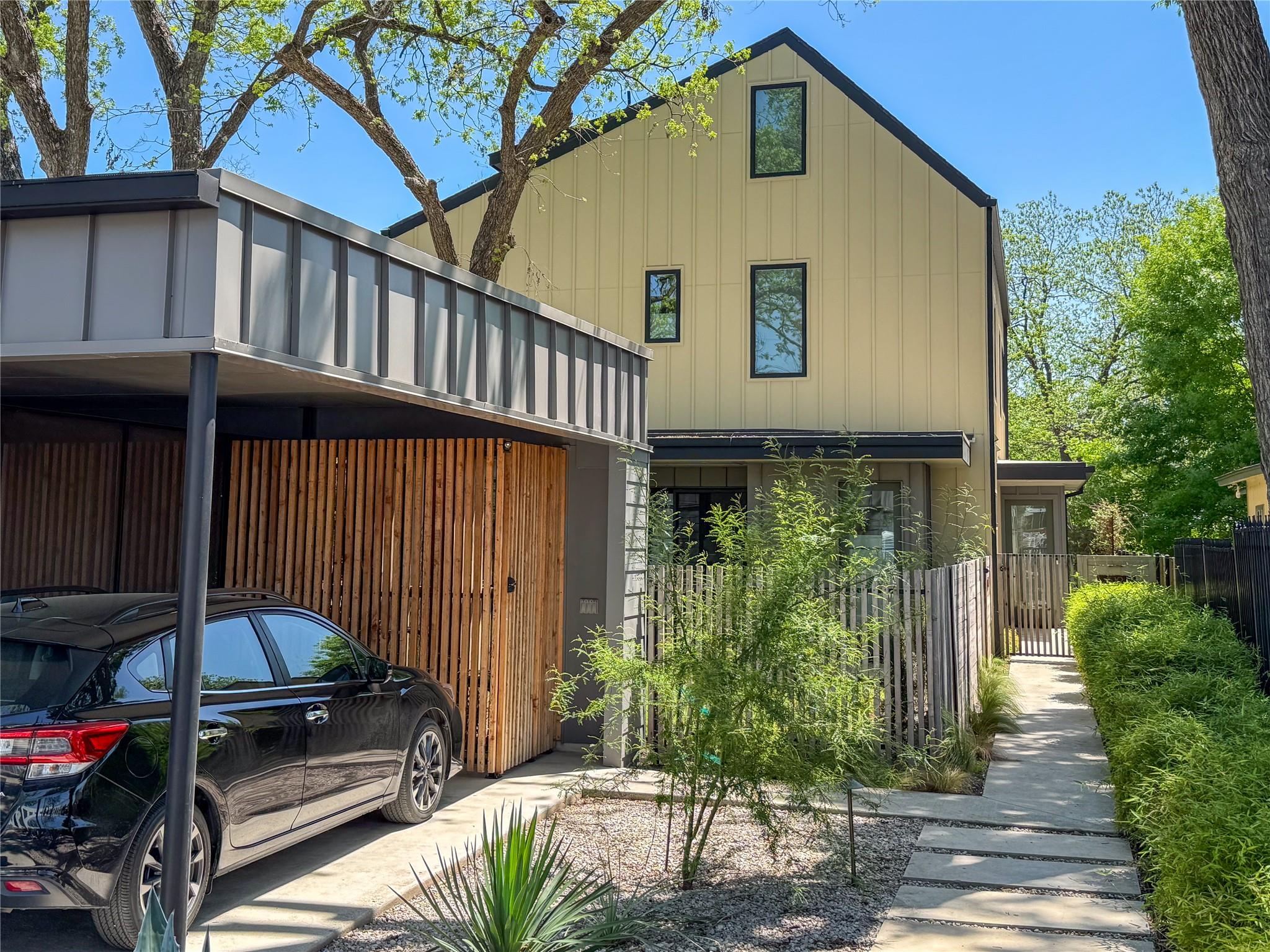 Board and batten siding pairs with a sleek metal 