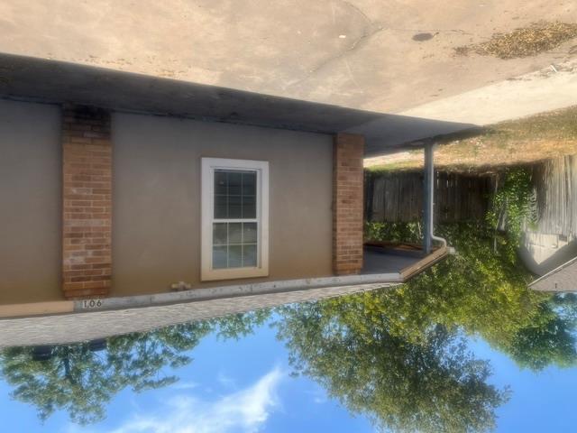 Brick accents and a classic window frame this ext