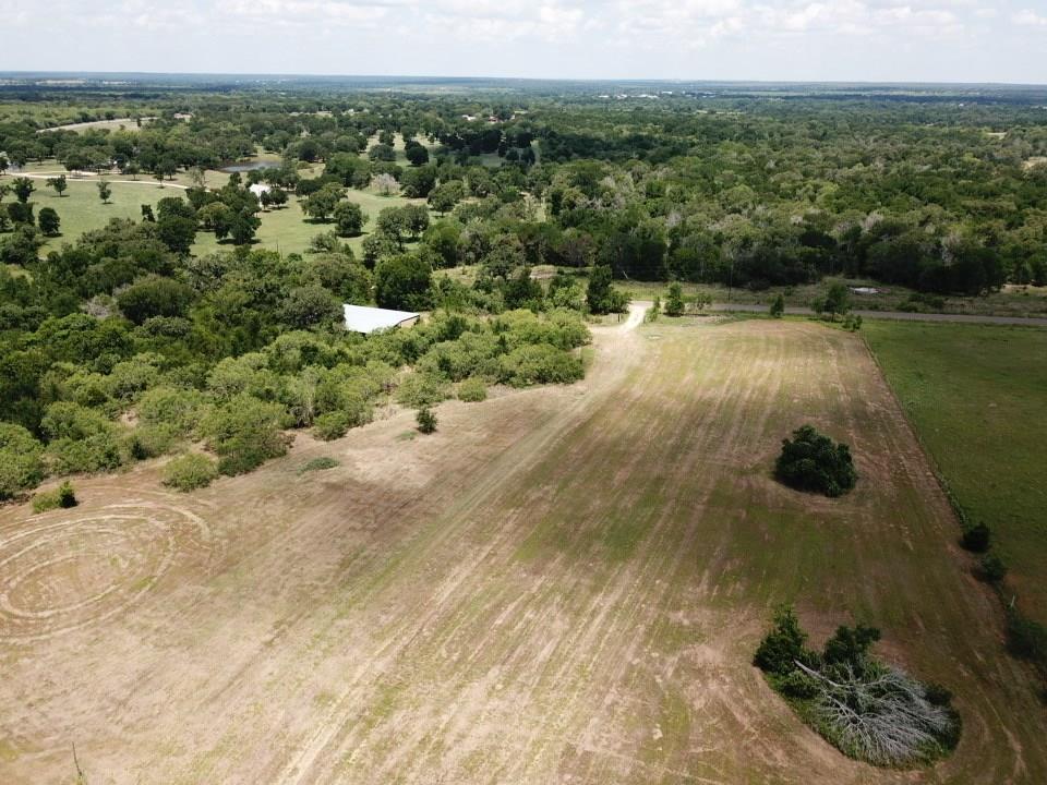 An aerial perspective showcases a rolling country