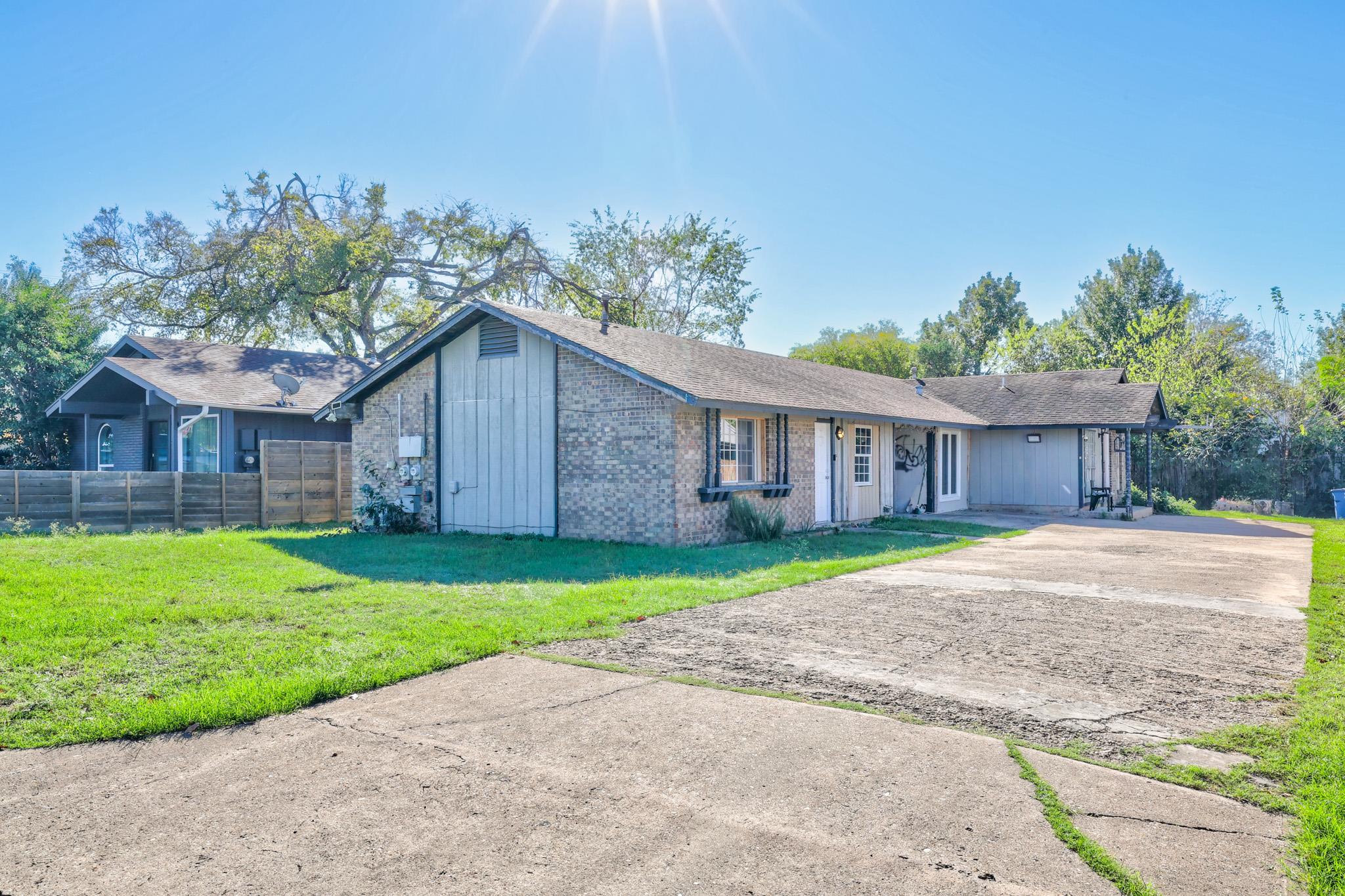 View of front of house featuring brick siding, a 