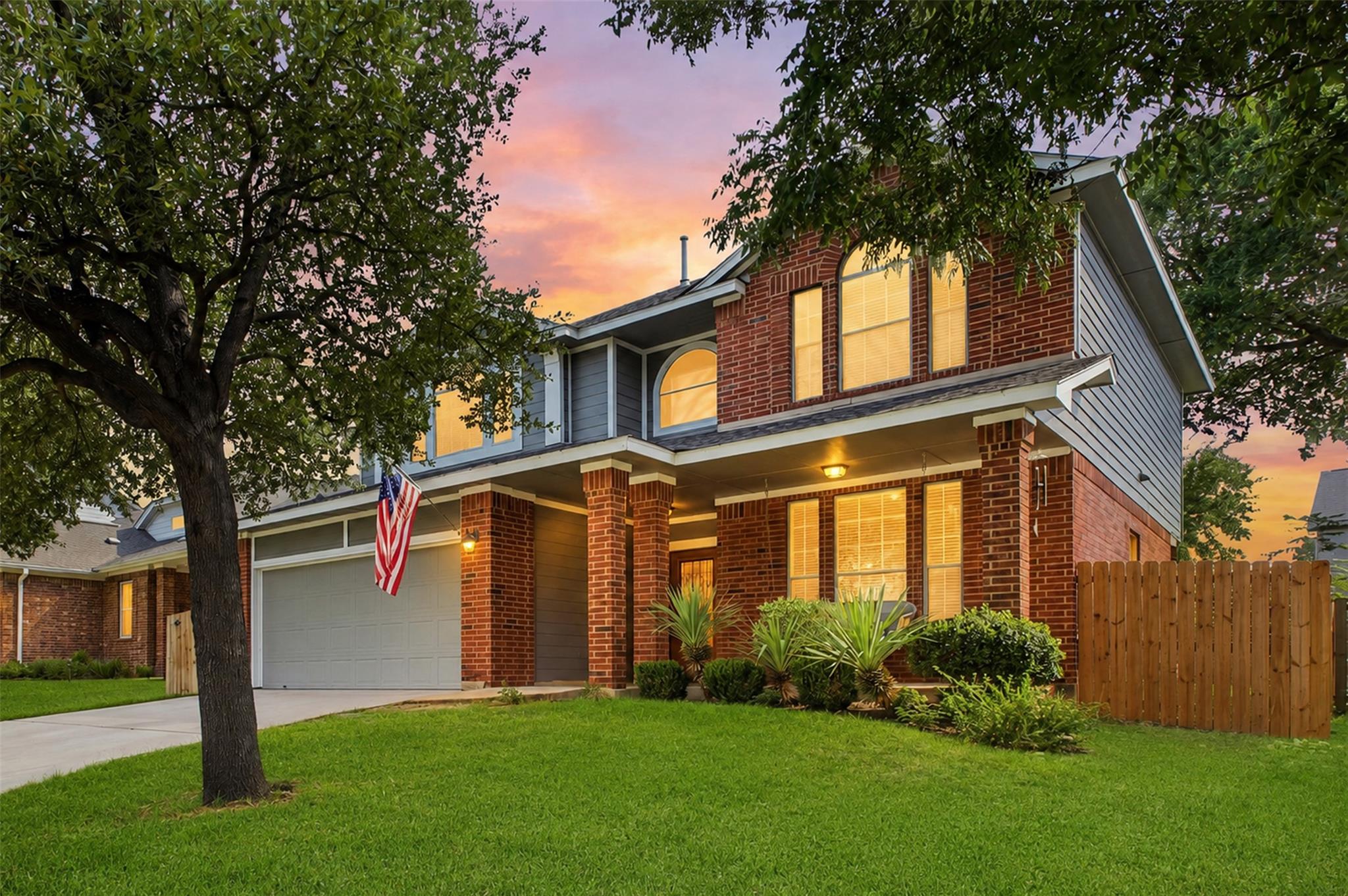 Traditional brick and siding accents frame a welc