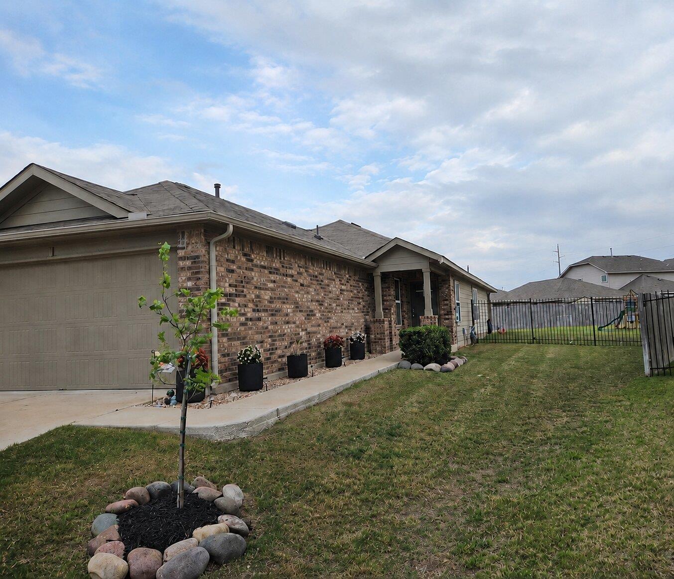 Classic brick siding and a neat concrete path def