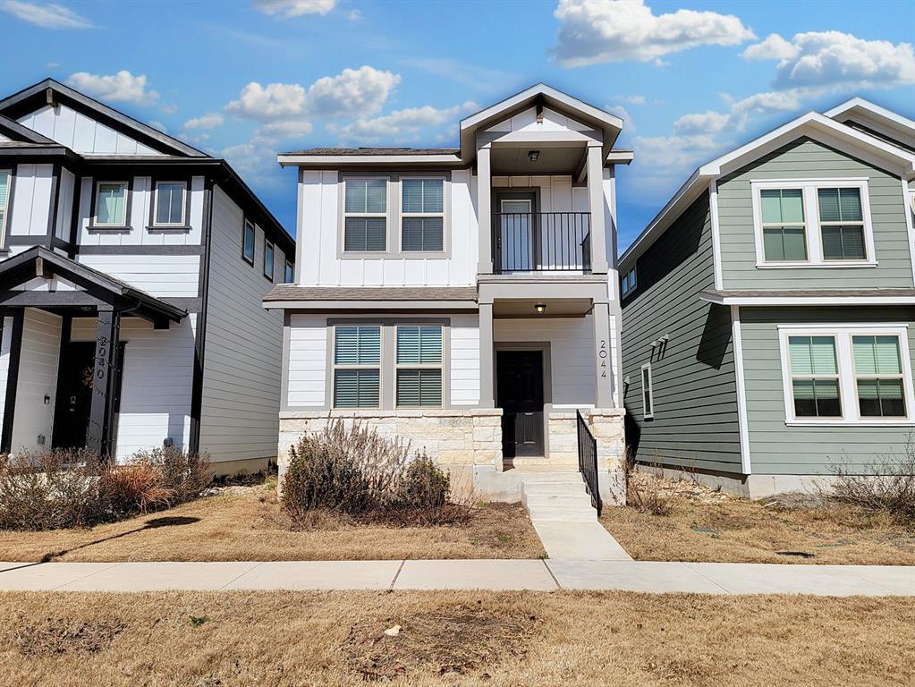 Two-story exterior with board and batten siding, 