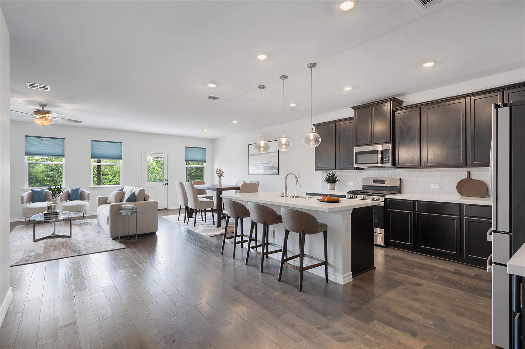 Polished hardwood flooring flows seamlessly throu