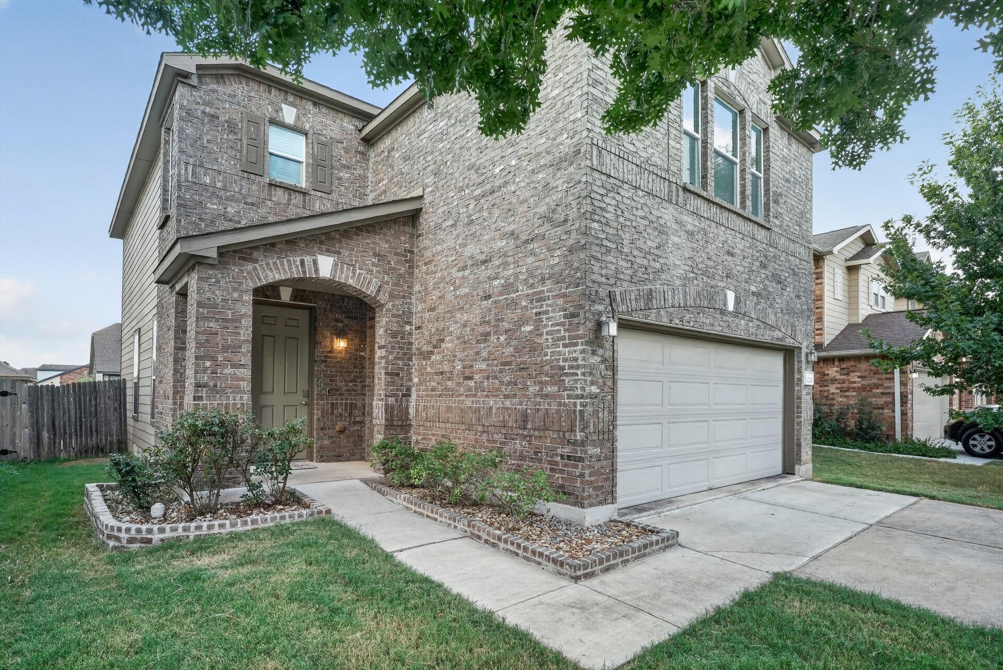 Textured brick masonry defines this traditional t