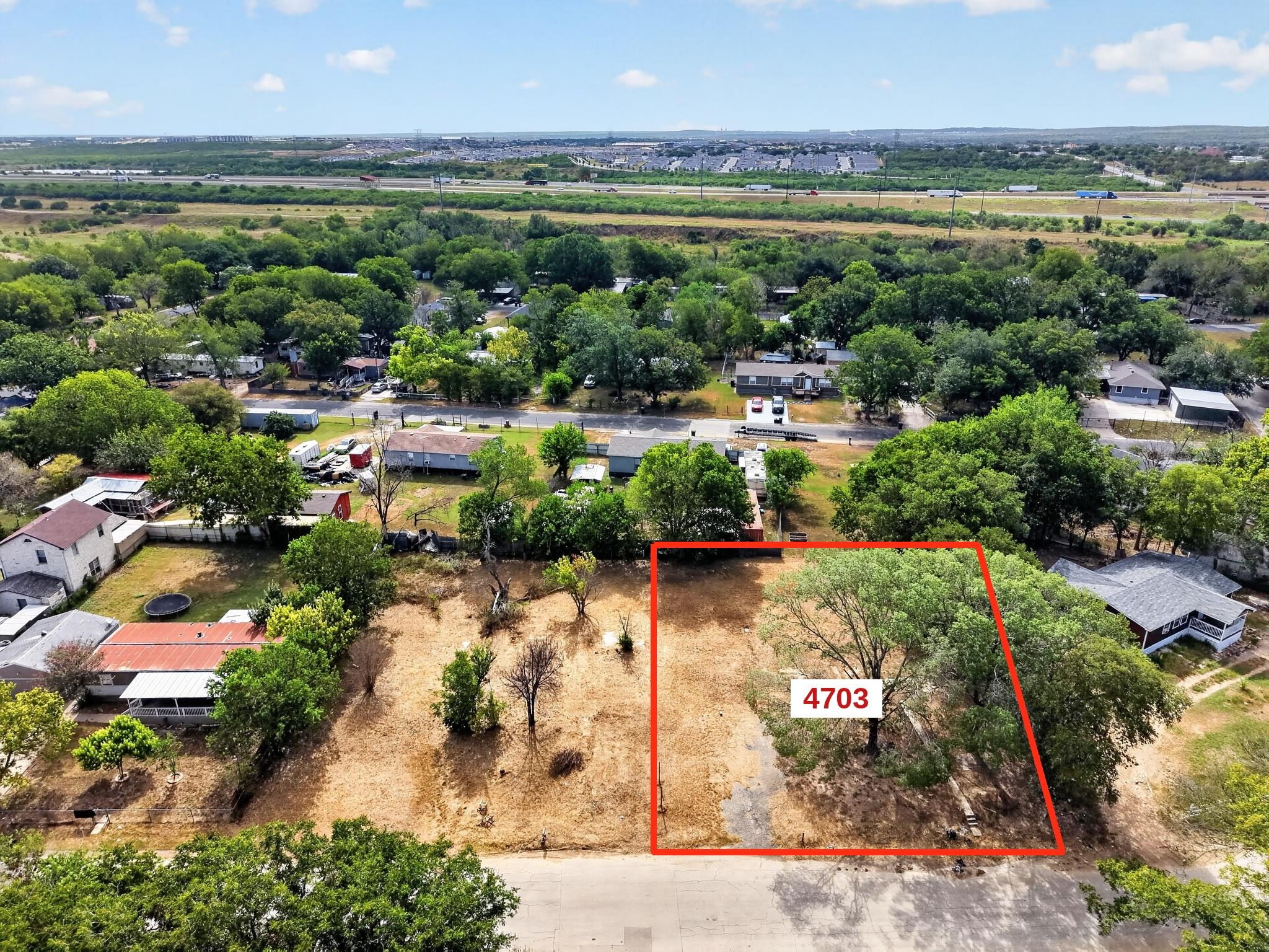 Mature trees frame this residential lot offering 