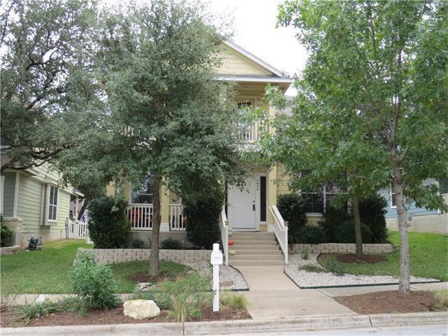 An inviting front entrance features a classic por