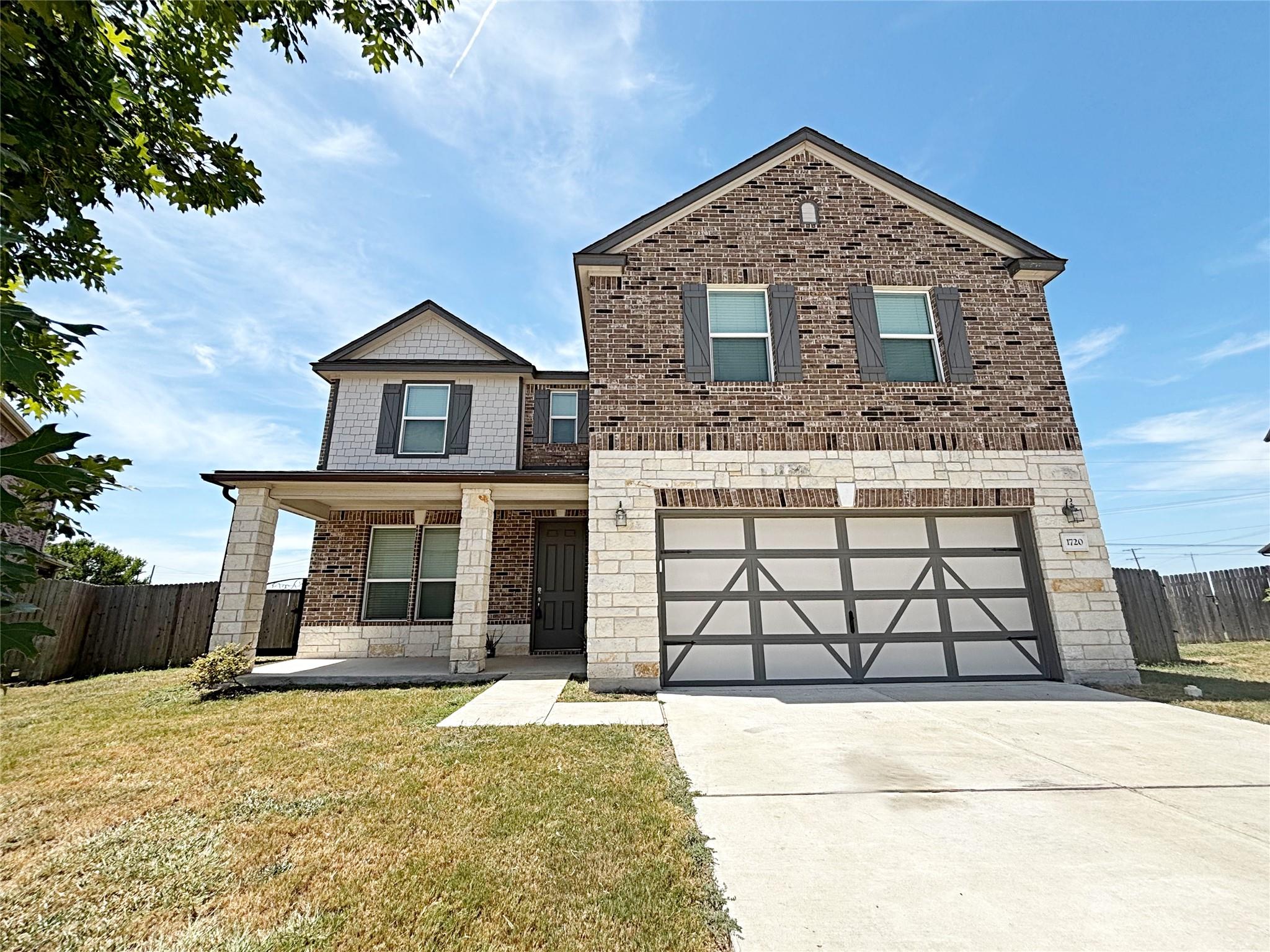 A classic brick and stone facade complements the 