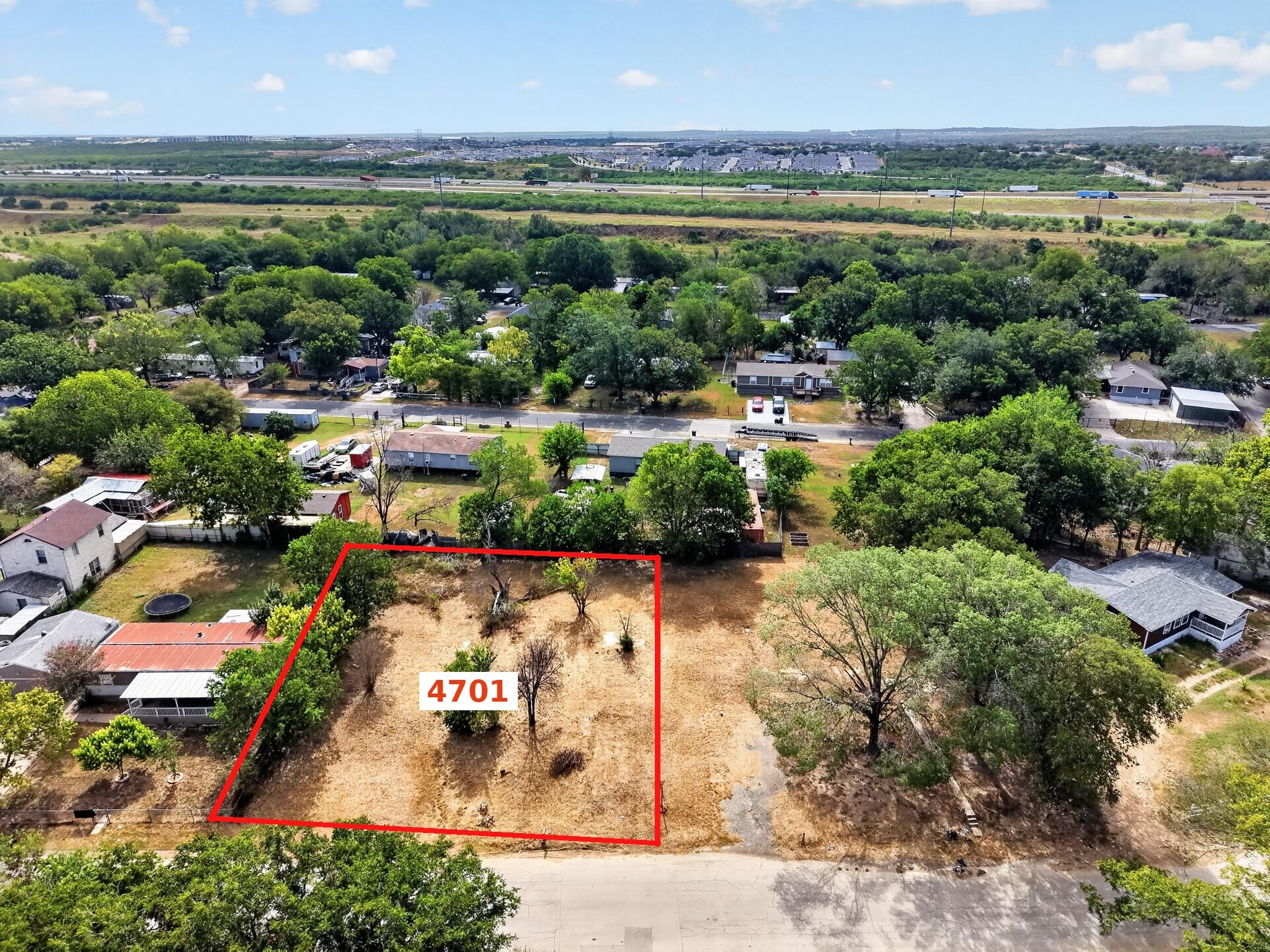 Mature trees frame a buildable neighborhood lot s