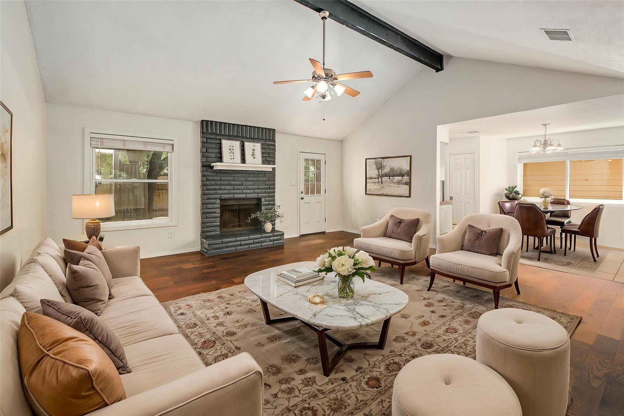 Rich hardwood flooring complements a dramatic bri