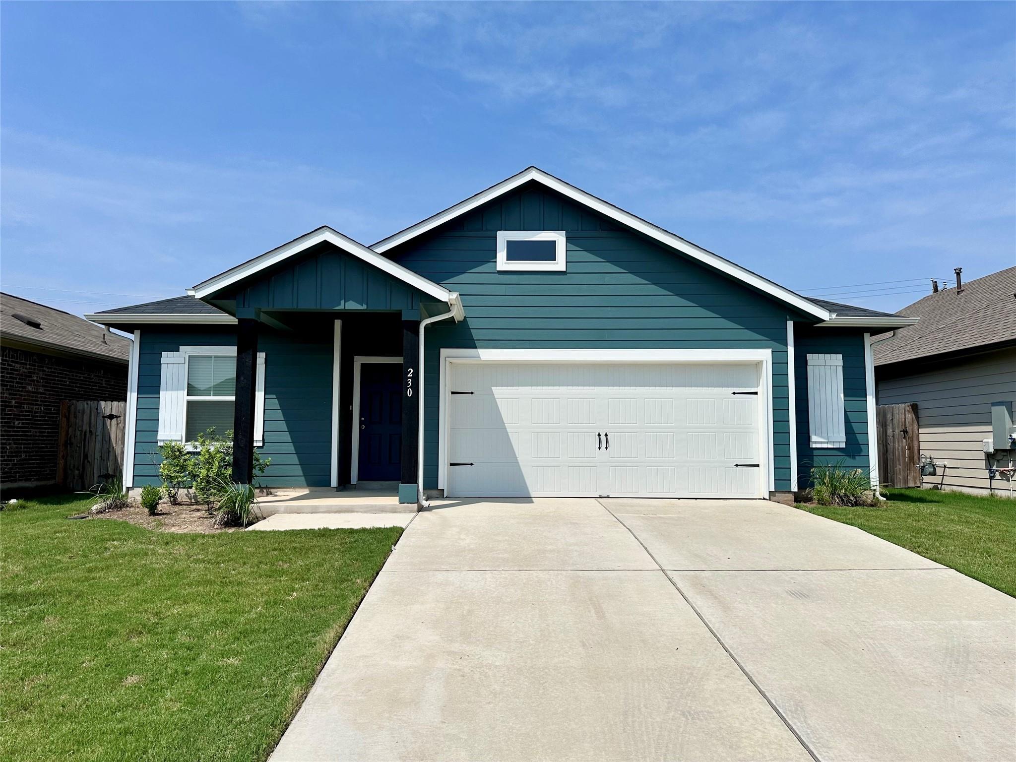 Crisp trim accents a classic gabled facade fronte