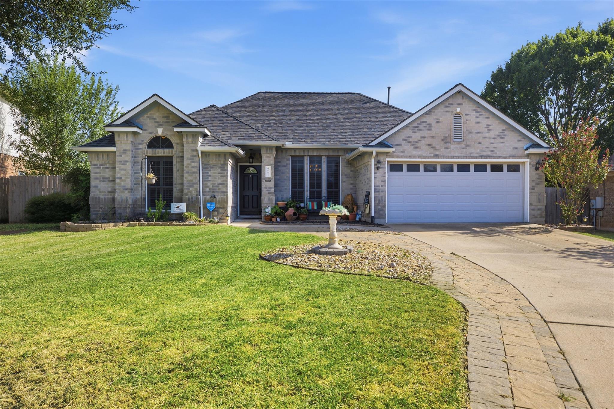 An attractive single-story brick facade anchors t