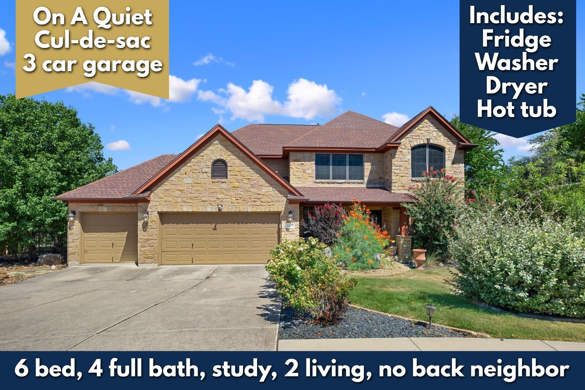 Stone accents and a multi-car garage define this 