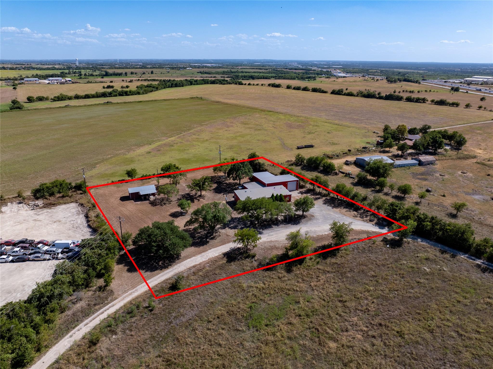 An aerial perspective showcases a rural property 
