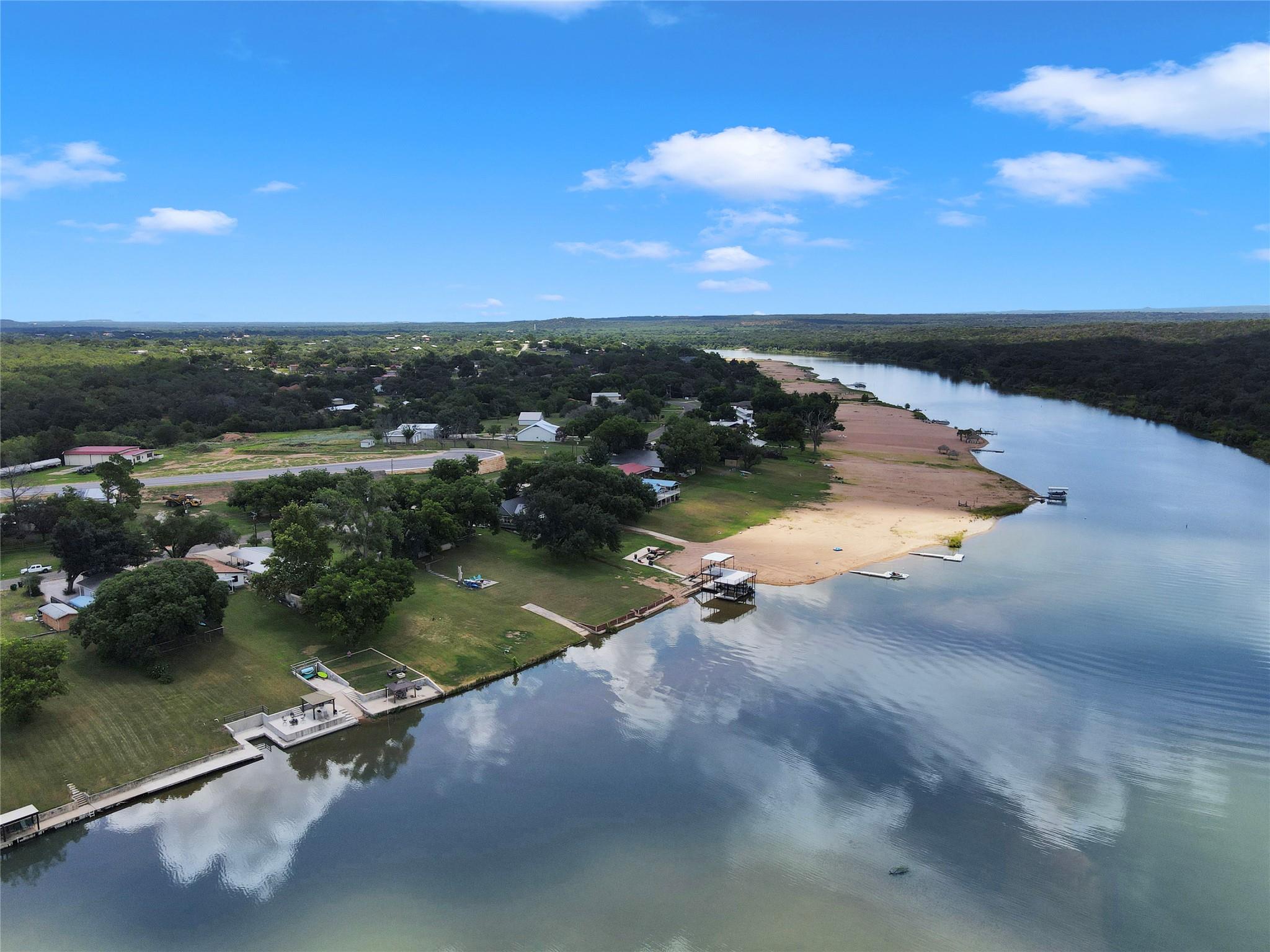 A quiet river bends past grassy shorelines and pr