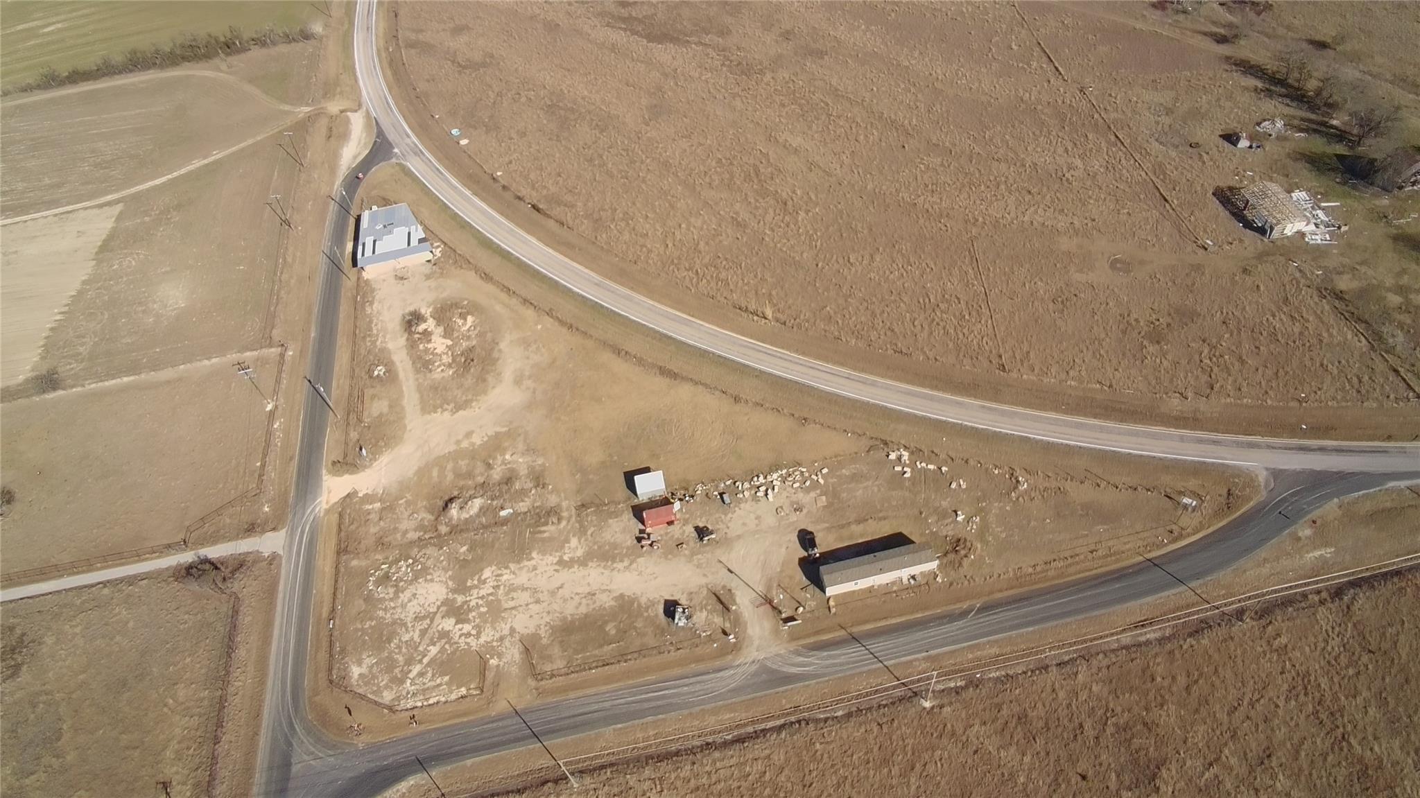 Aerial view reveals several outbuildings on a spa
