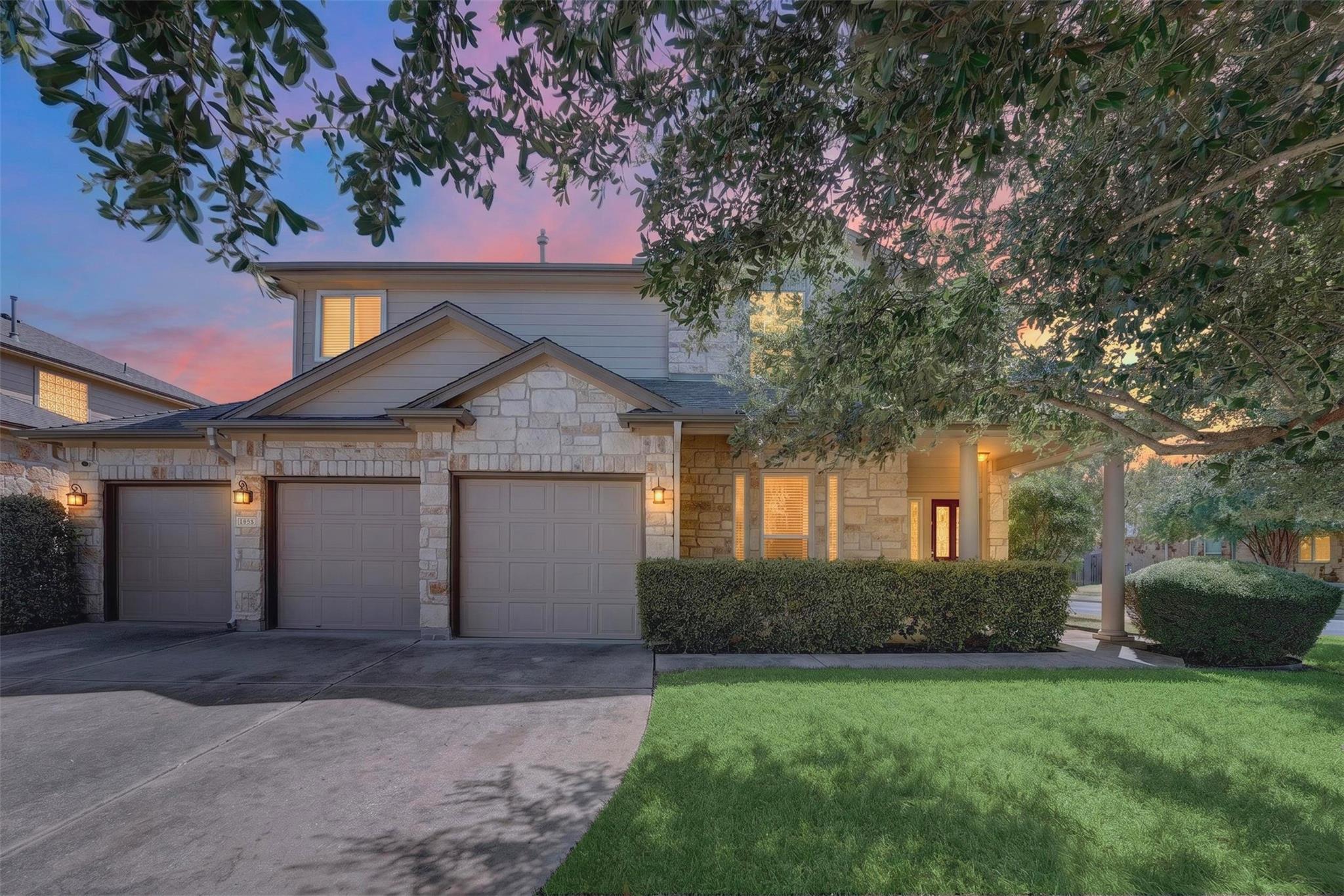 Stone and siding accents define the exterior of t