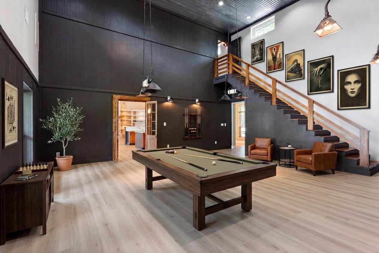 Soaring ceilings and a dramatic open staircase an