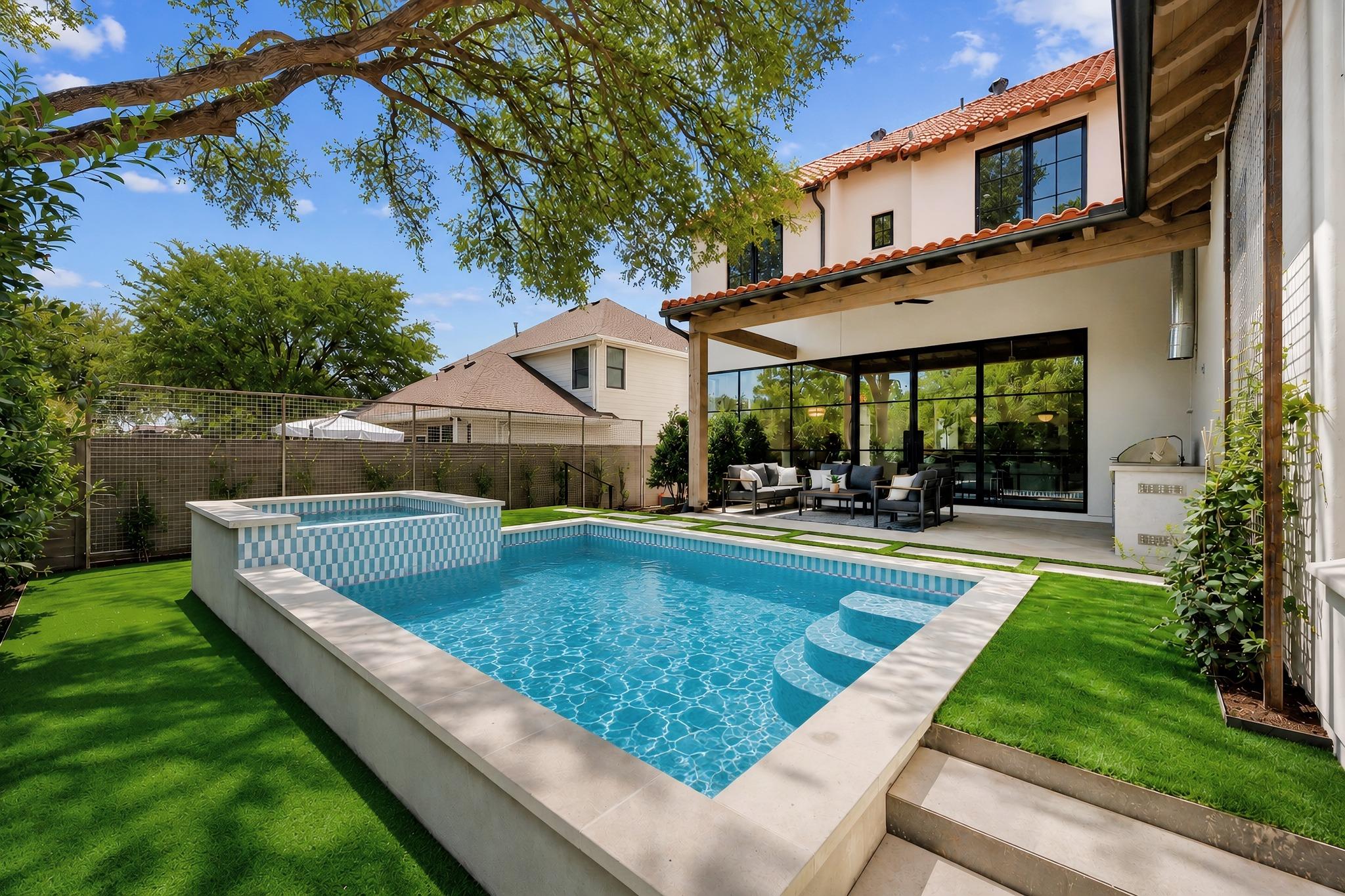 An inviting backyard oasis centers around a geome