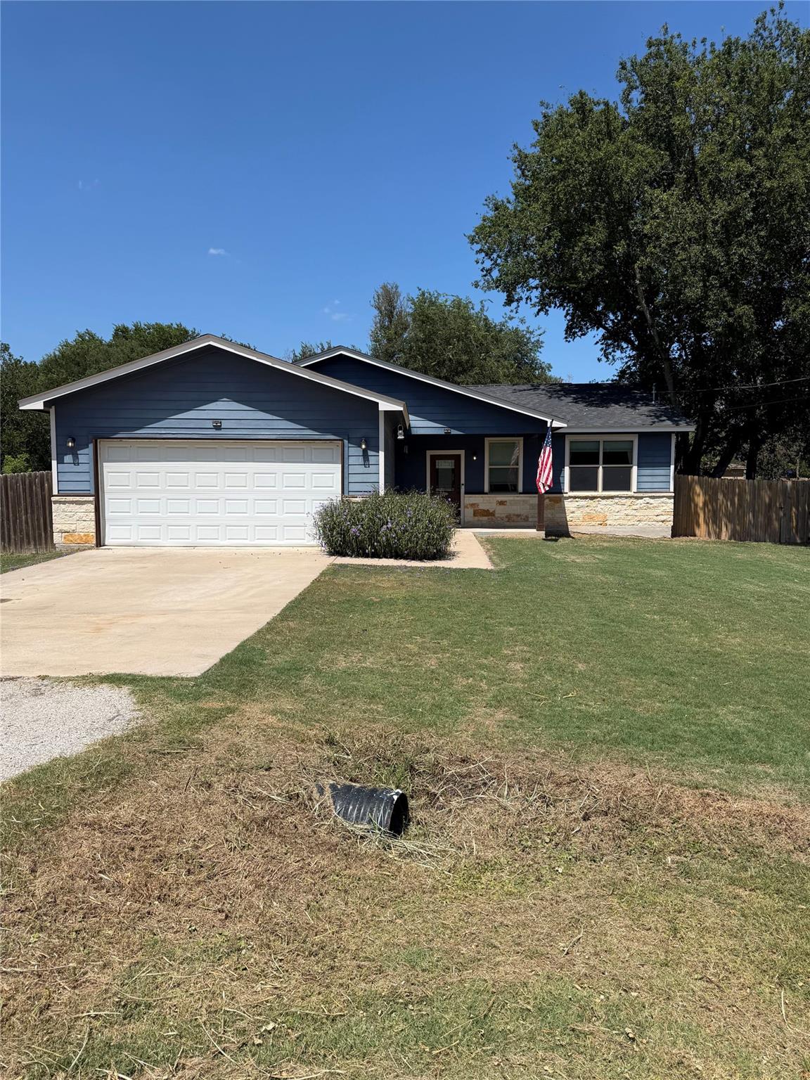 An inviting front lawn frames a classic single-st