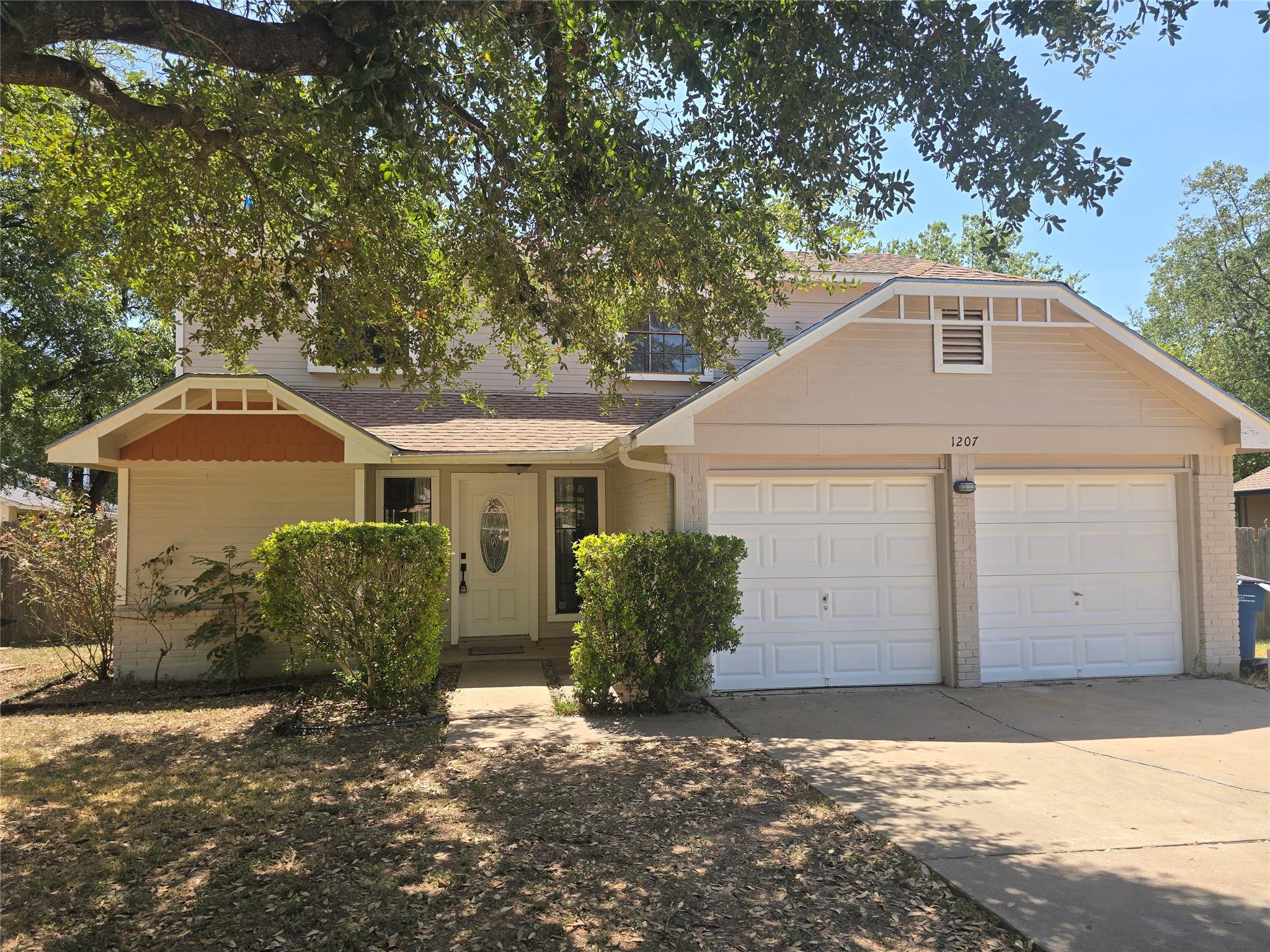 Established trees shade the classic exterior and 