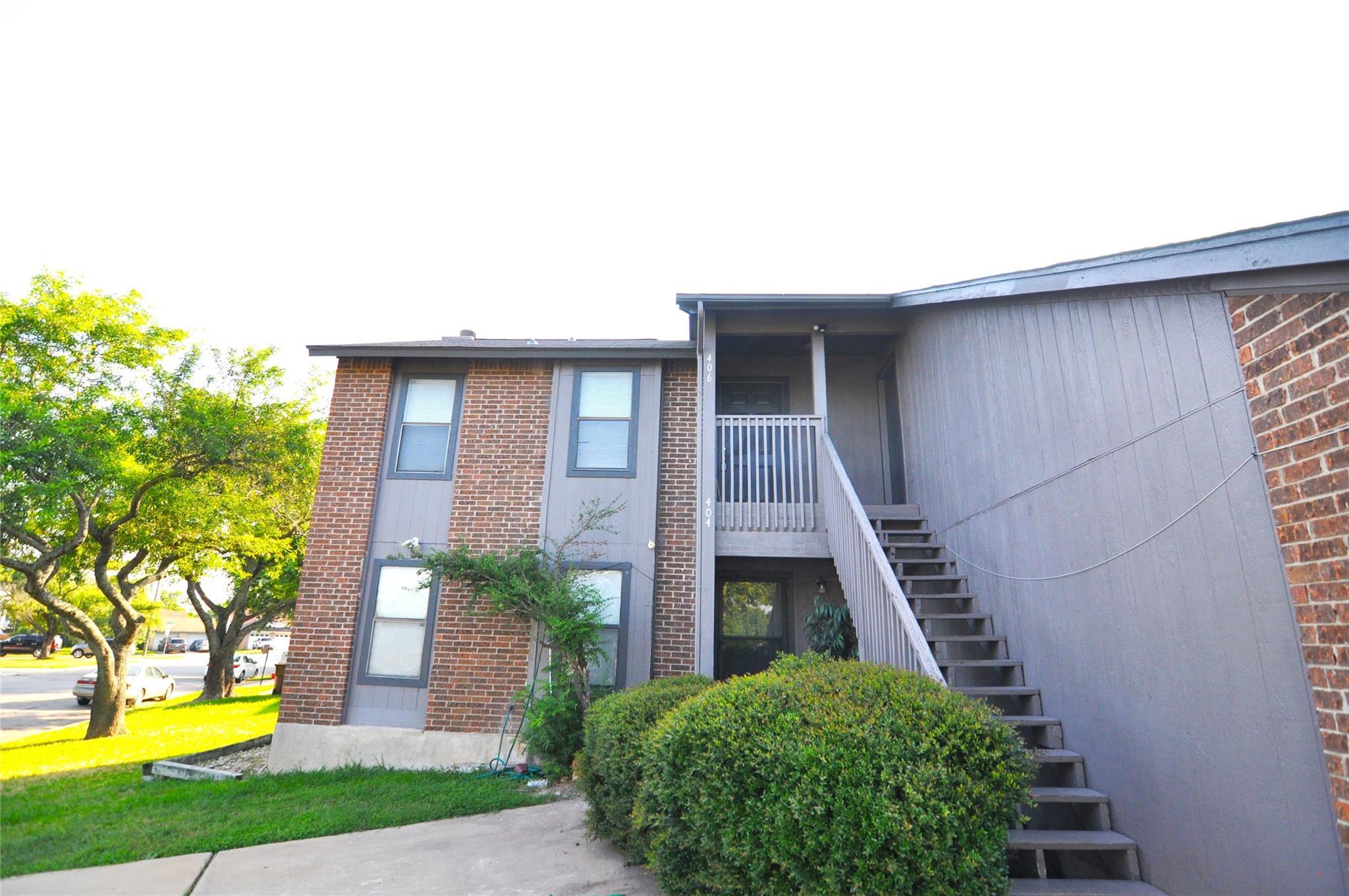 Sturdy brick cladding and vertical siding highlig