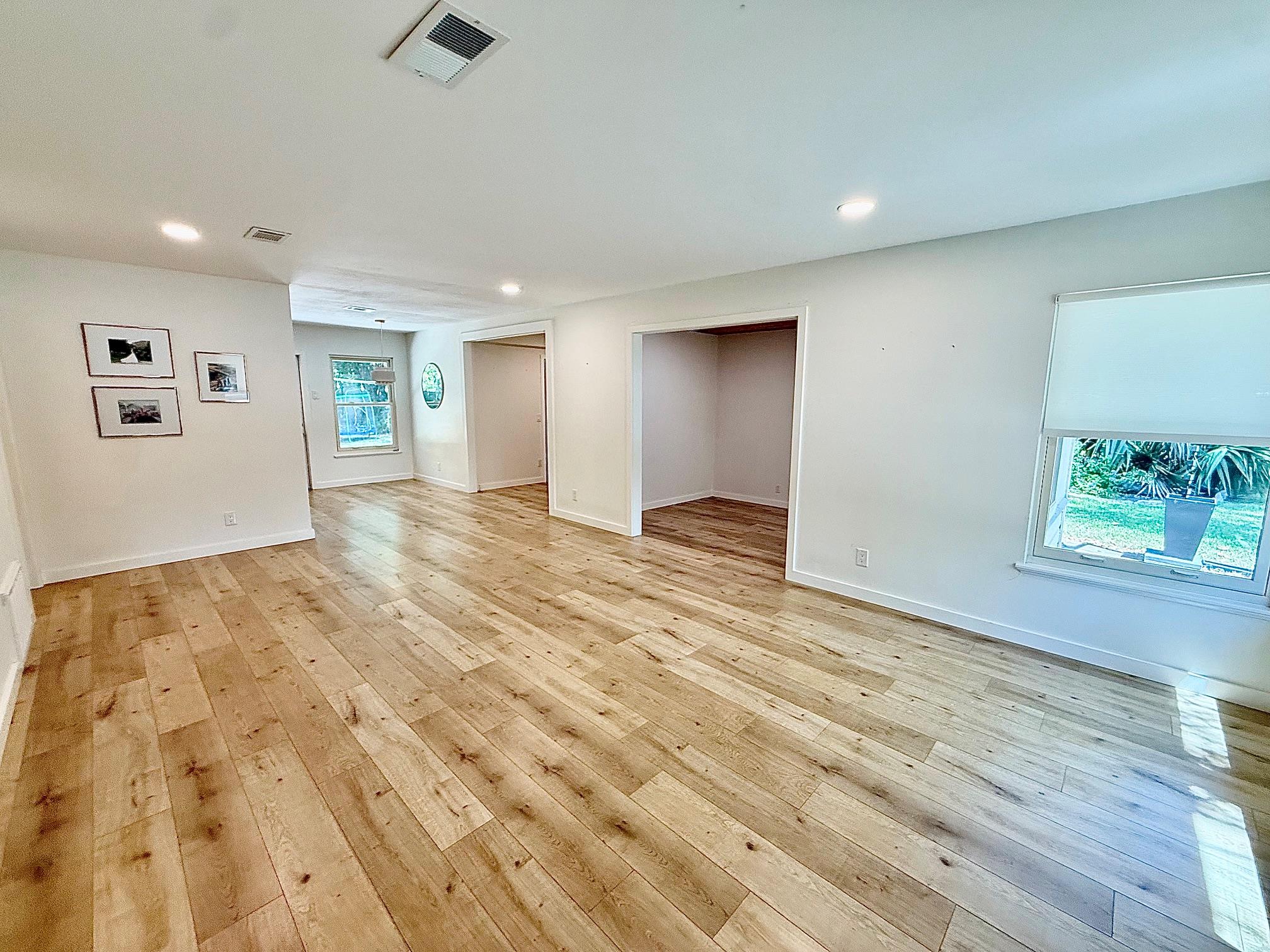 An open layout with classic wood flooring and wid