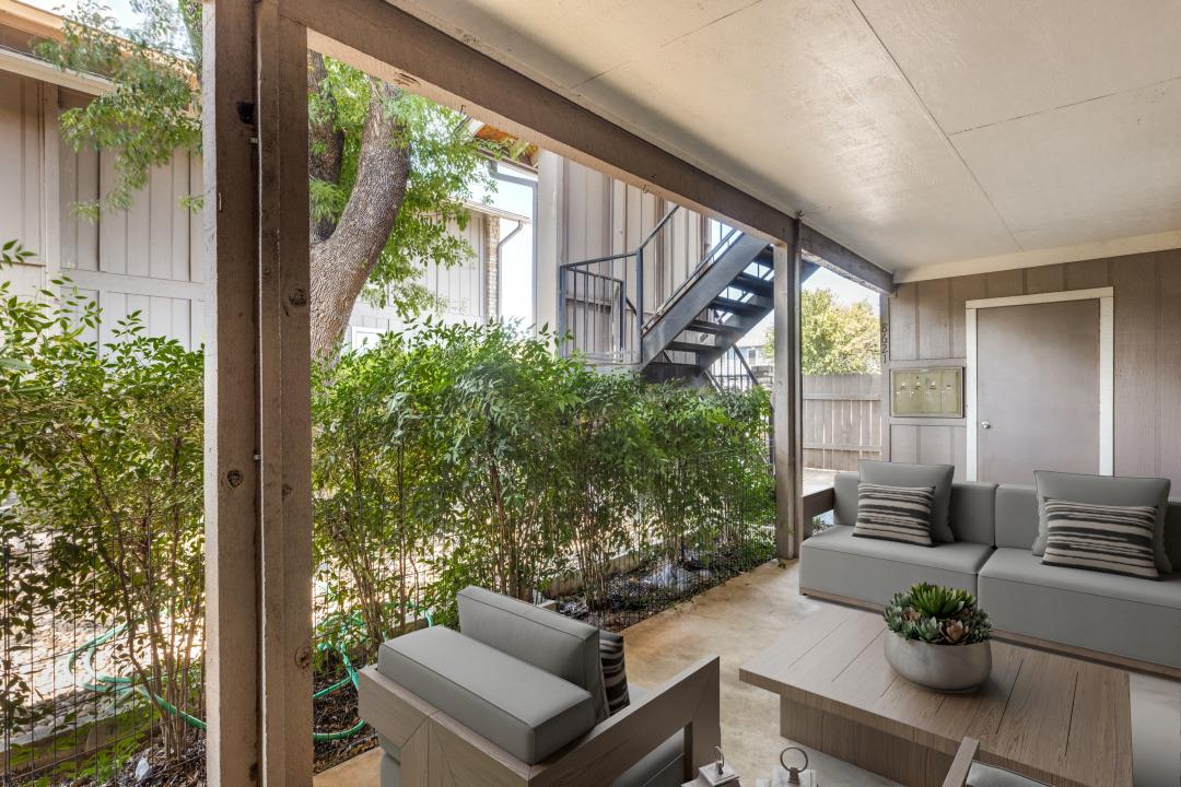 Sheltered outdoor living space provides a covered