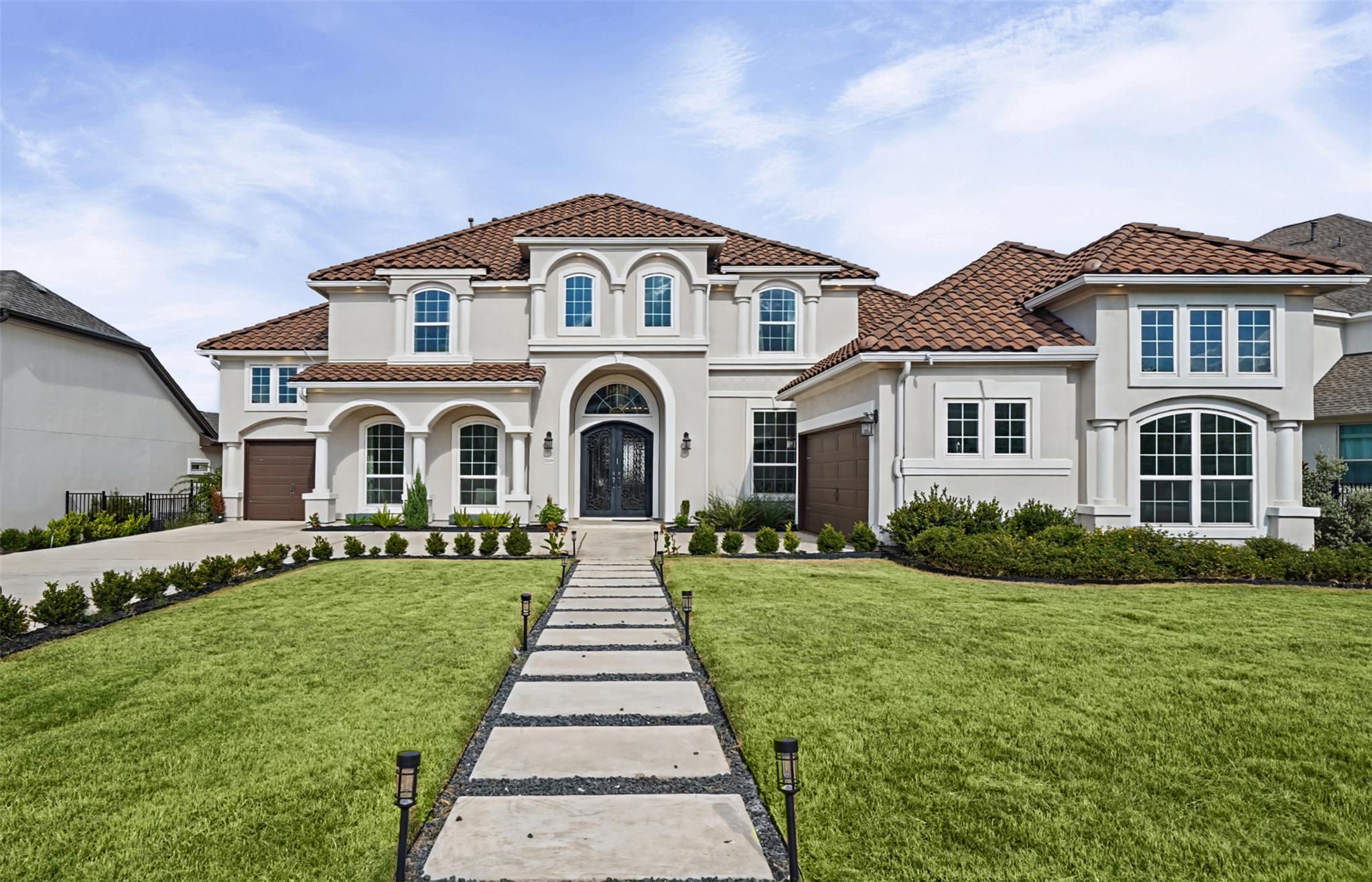 An elegant paved walkway leads directly to the ar