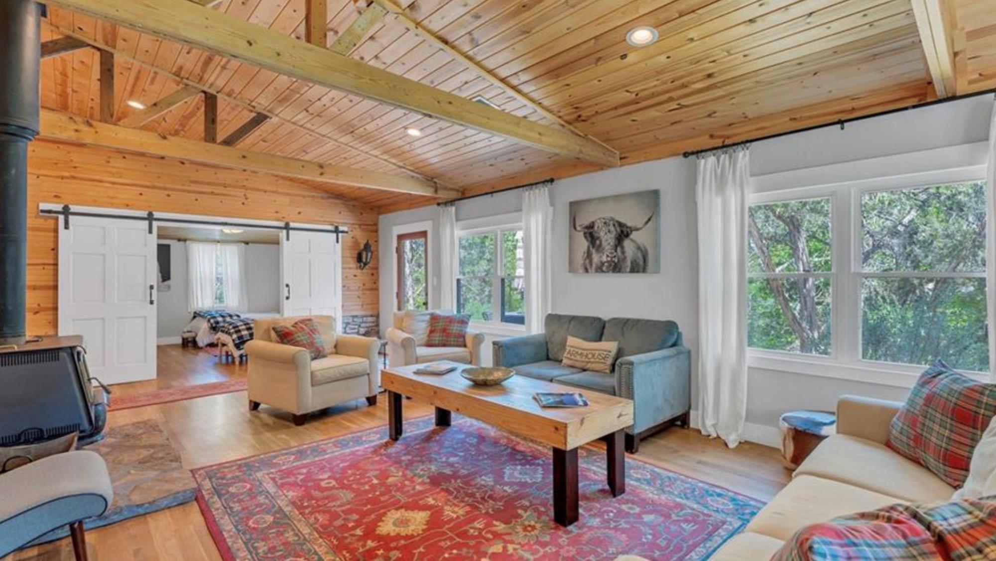Warm wood ceilings and exposed beams crown a rust
