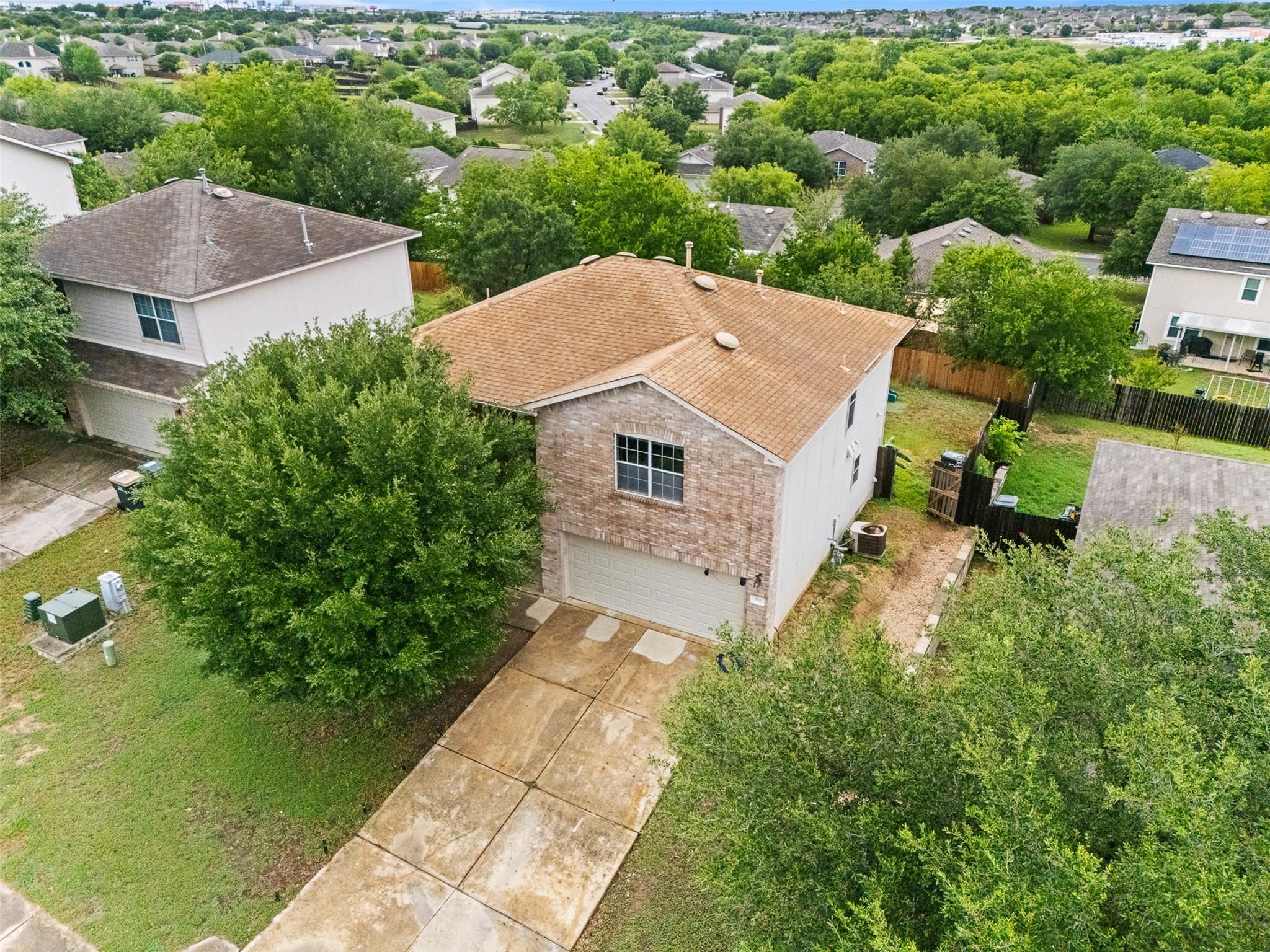 An aerial perspective showcases a two-story brick