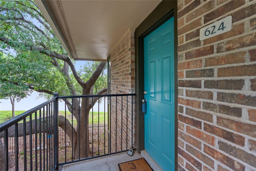 An inviting entrance is framed by classic brick s