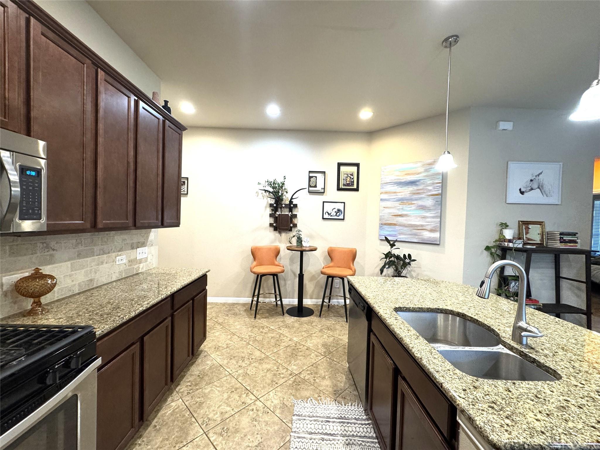 Polished granite countertops and classic tile flo
