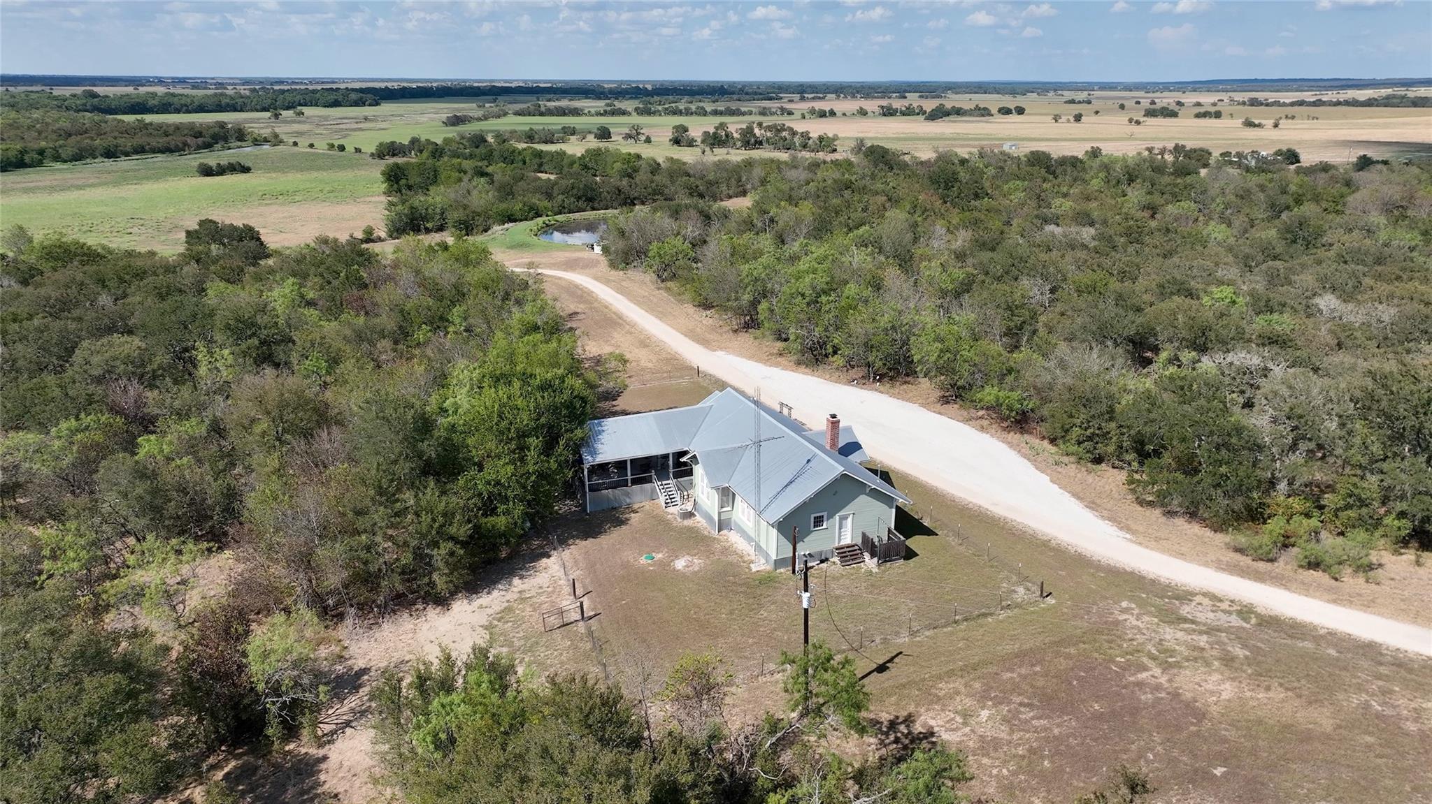 Mature trees surround this peaceful country home 
