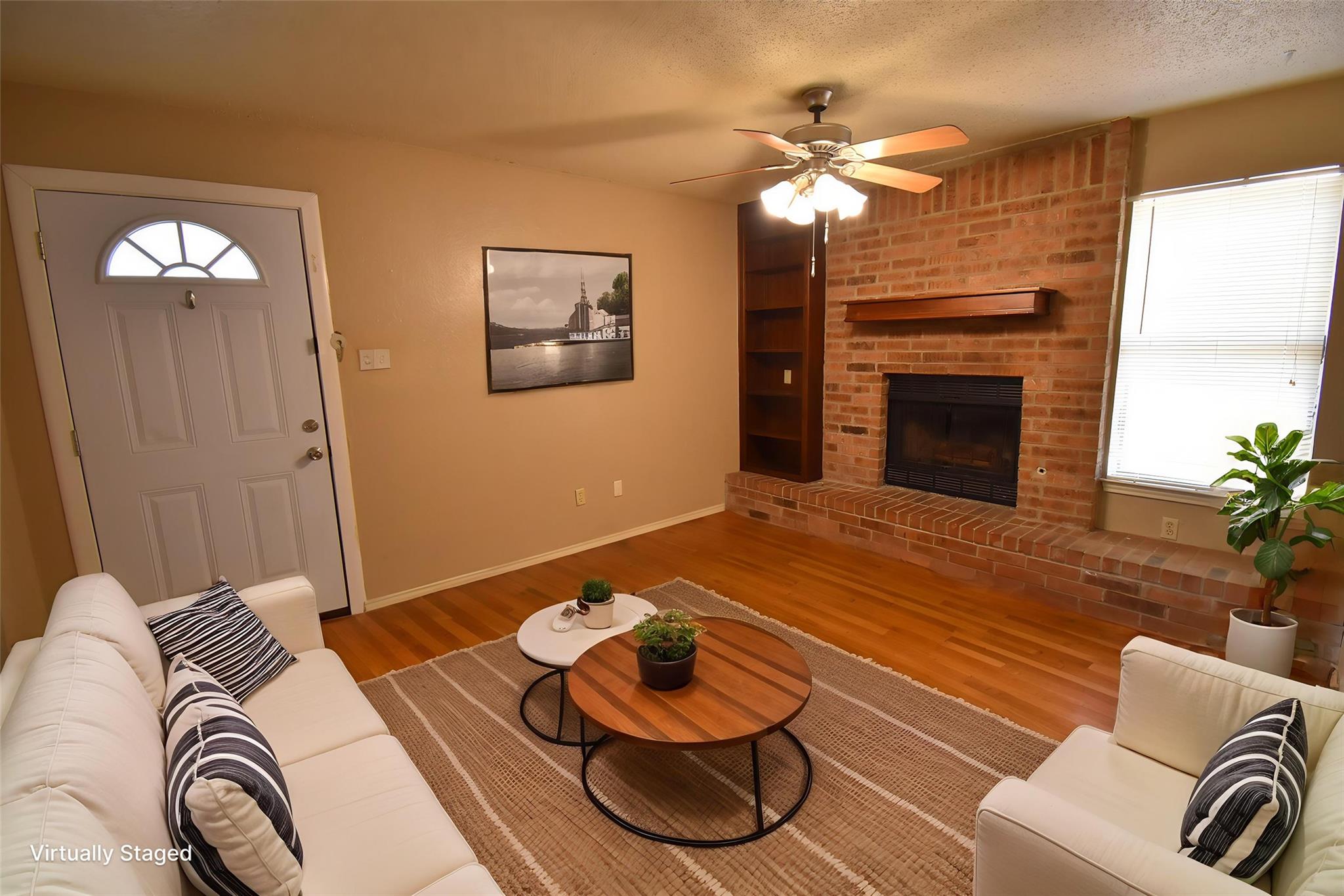 Warm wood flooring grounds this welcoming space f