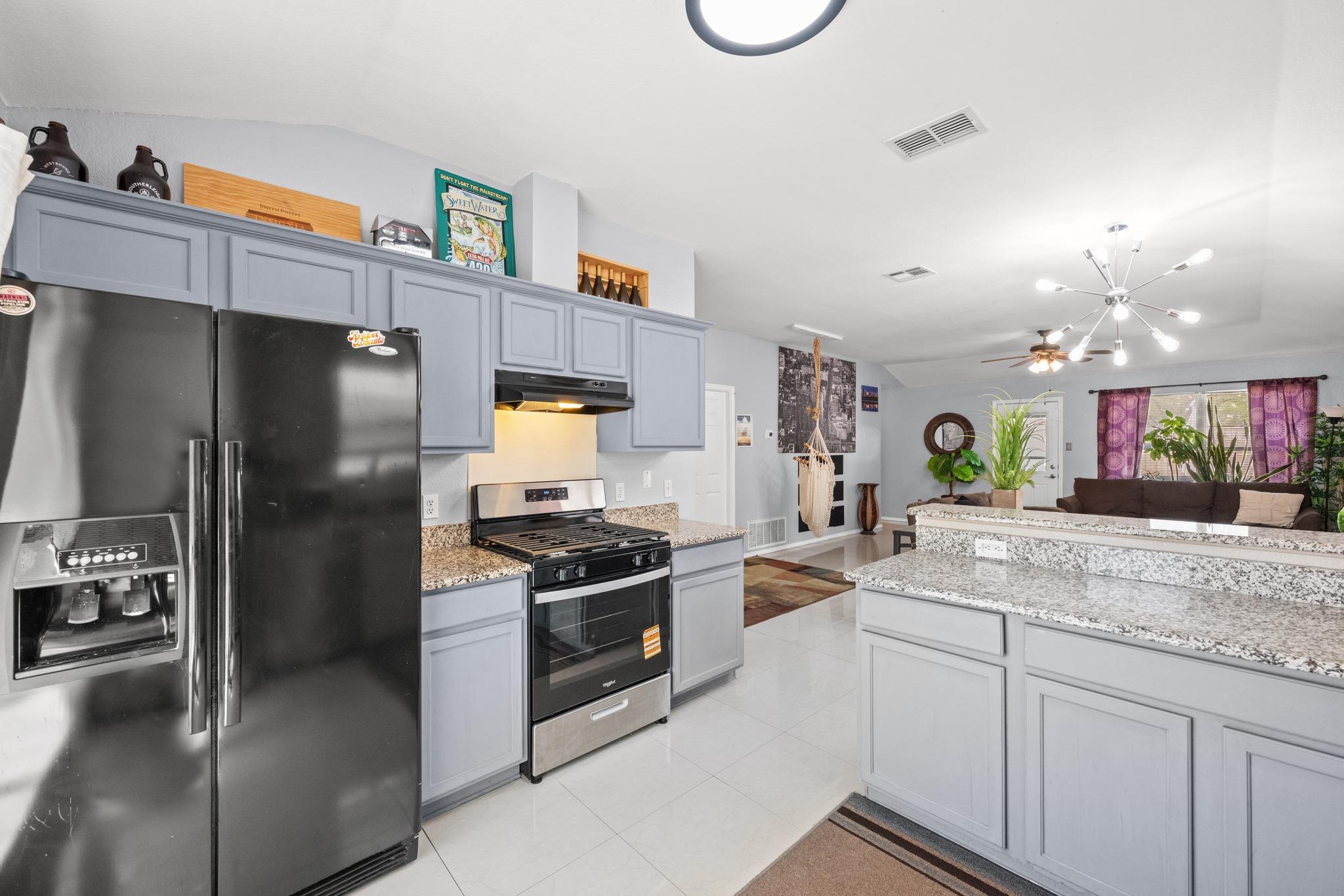 An open kitchen layout flows seamlessly into the 