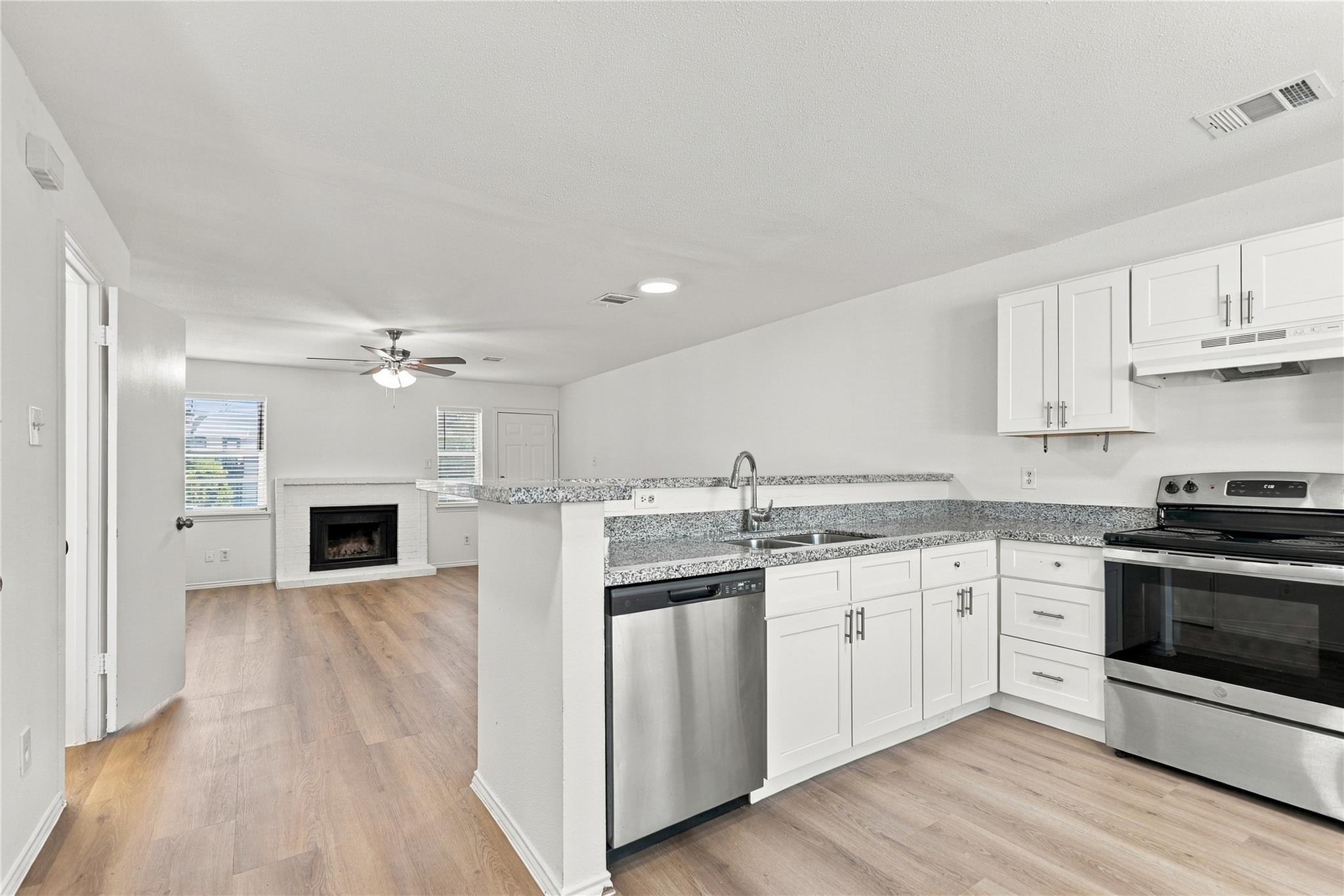 An open kitchen layout flows seamlessly into the 