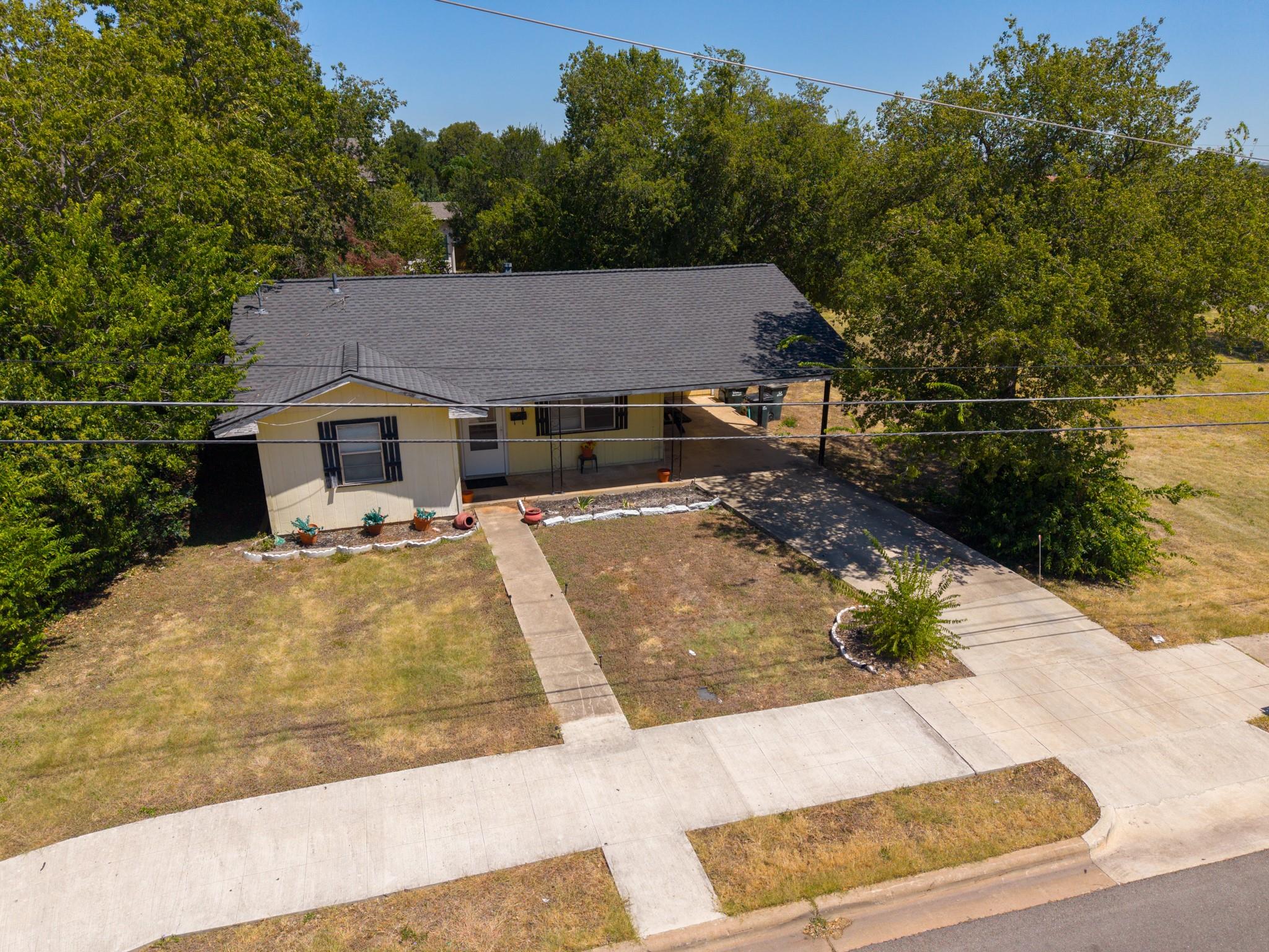 A classic single-story home nestled among mature 