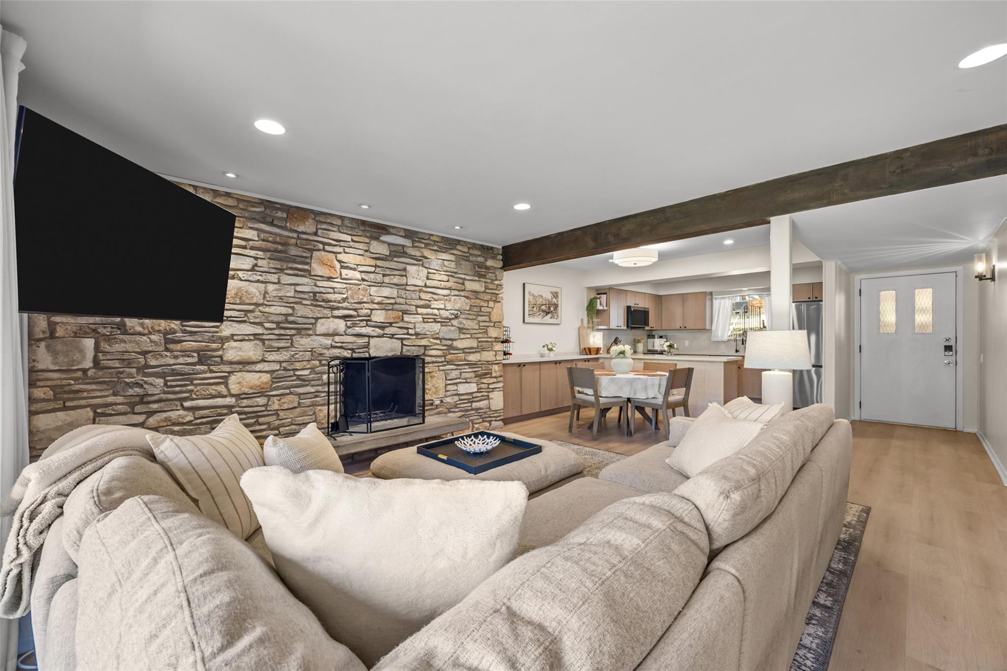 An impressive stone fireplace wall and exposed ti