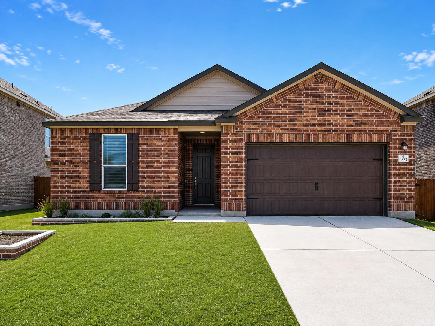 Classic brick exterior showcases gabled rooflines