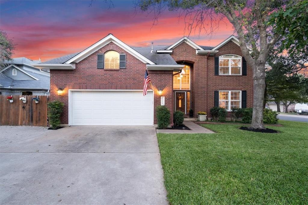 Stately brick exterior featuring a double-gabled 