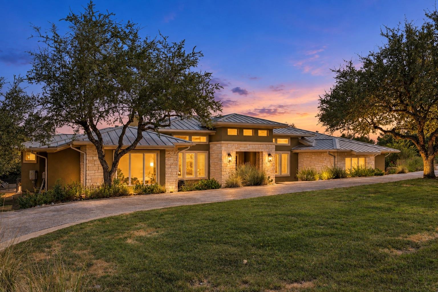 Native stone accenting and a standing-seam metal 
