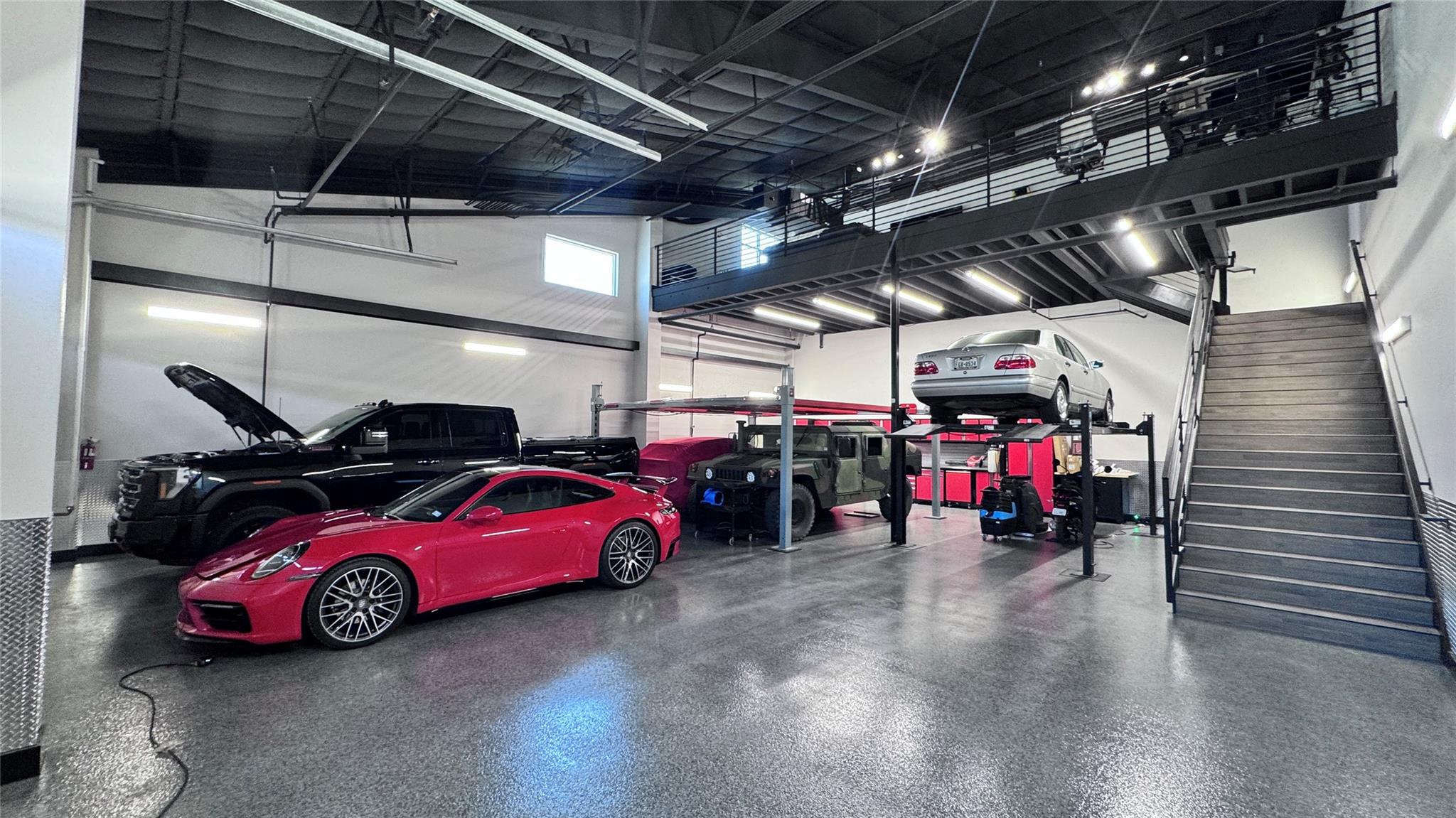 An expansive multi-level garage features epoxy co