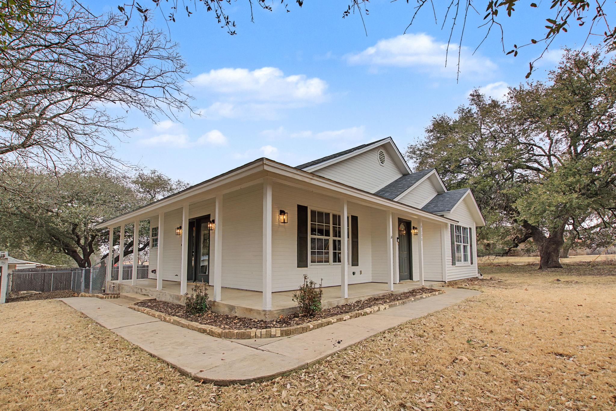 A spacious wrap-around porch highlights the charm
