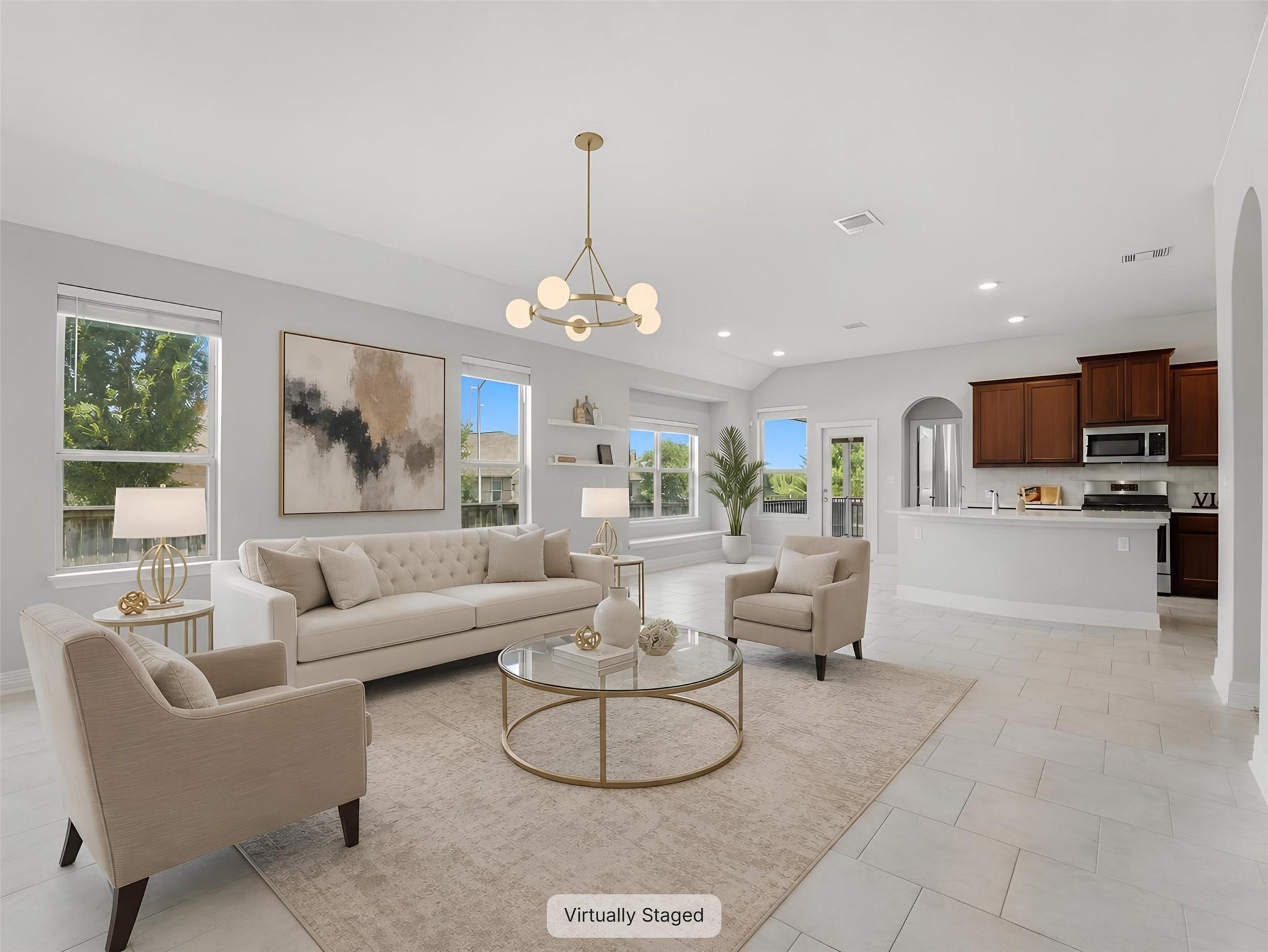 An open-concept living space integrates a well-ap
