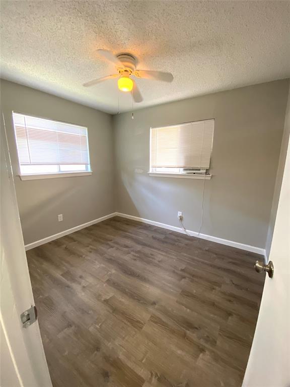 Smooth wood-look flooring and dual windows elevat