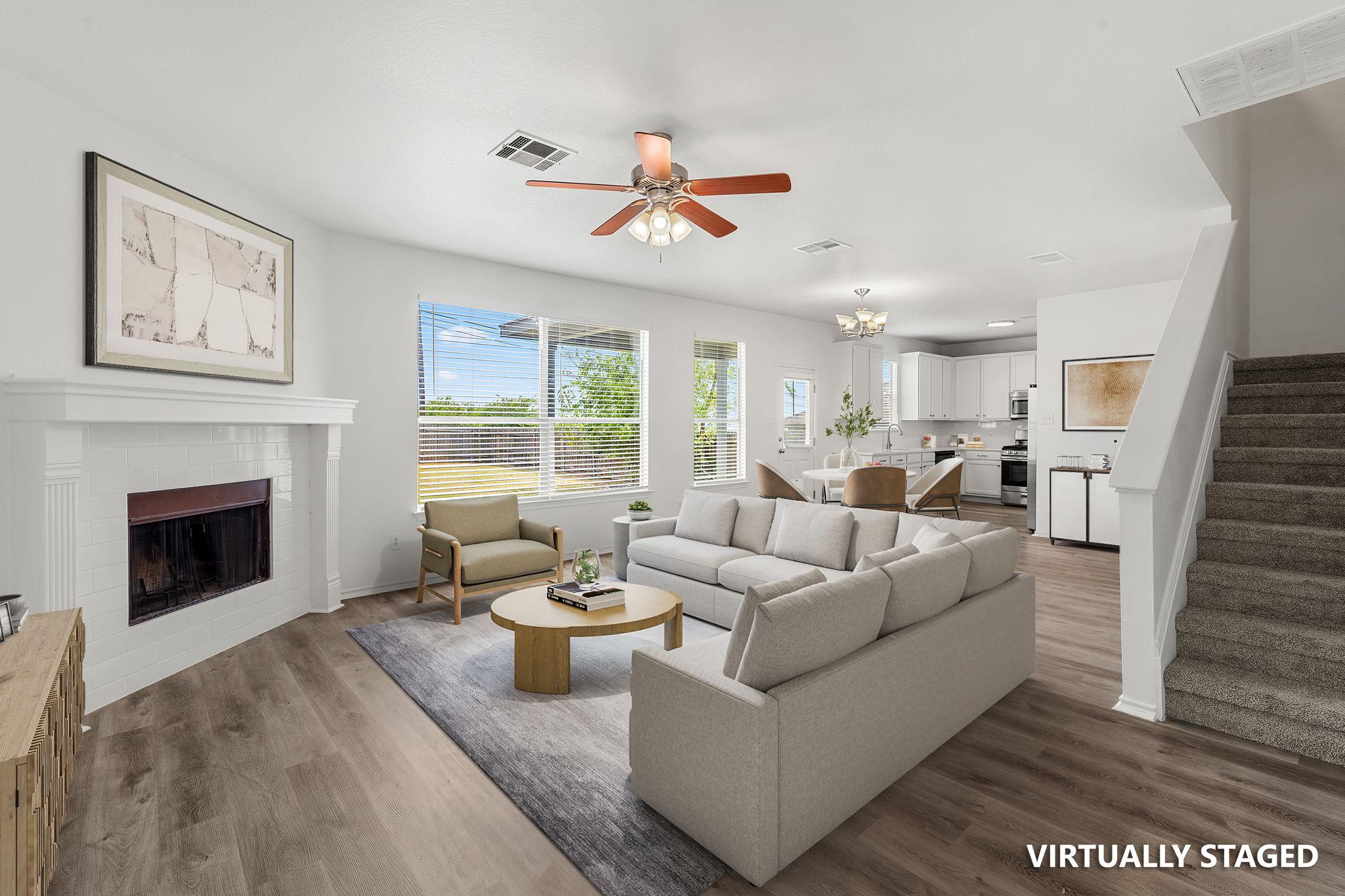 An open-concept living area flows into the dining