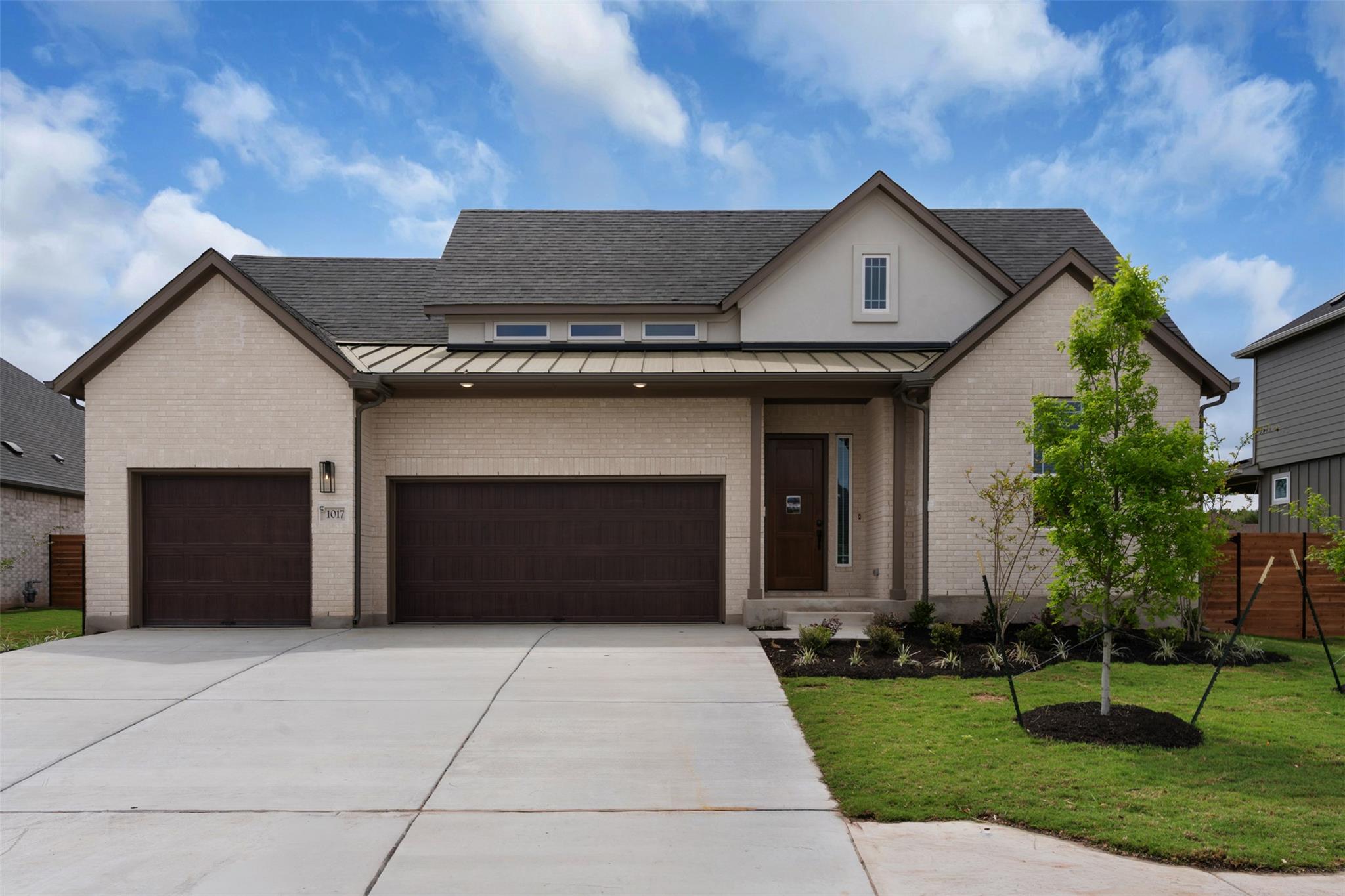 An elegant brick facade pairs with a spacious con