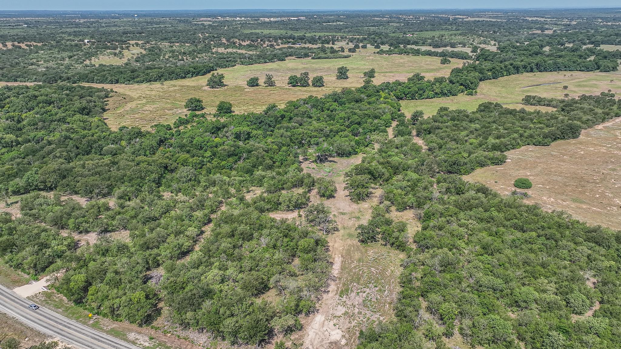 Mature trees and open pastures blanket this expan