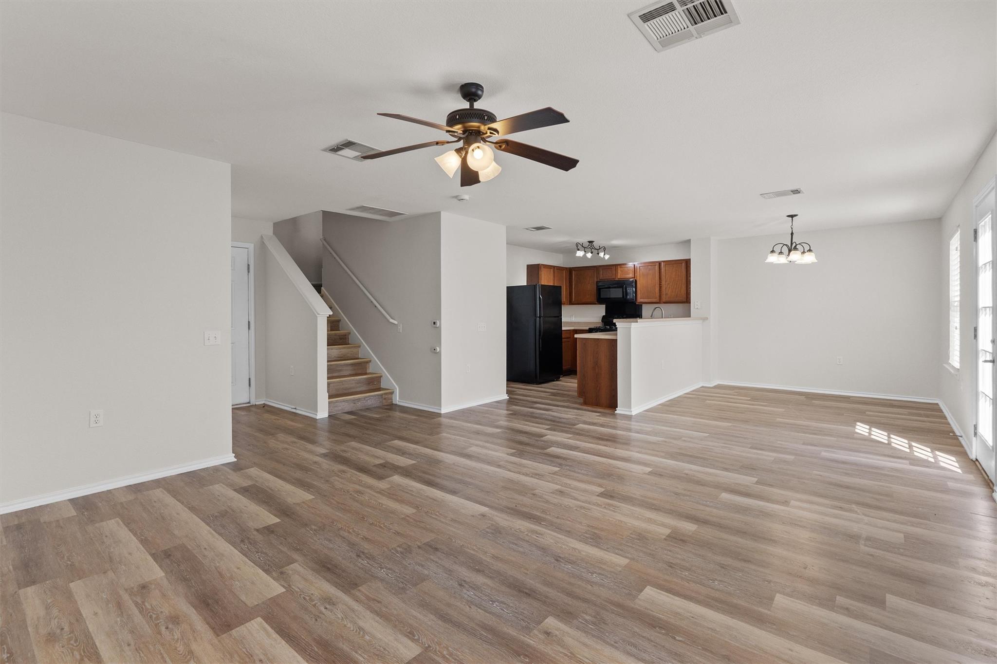 Polished hard-surface flooring flows seamlessly t